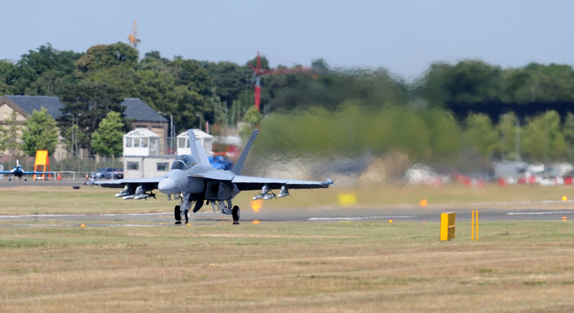 FARNBOROUGH, United Kingdom – A Navy F/A-18F Super Hornet, prepares for takeoff for an aerial demonstration during the Farnborough International Air Show July 19. The demo showcases the aircraft’s handling and maneuvering capabilities during the week-long event. Nearly 70 aircrew and support personnel from bases across Europe and the United States participated in the air show. This premier global aviation event allows exhibitors to showcase their newest aerospace equipment and technology. (U.S. Air Force photo/Staff Sgt. Jerry Fleshman)