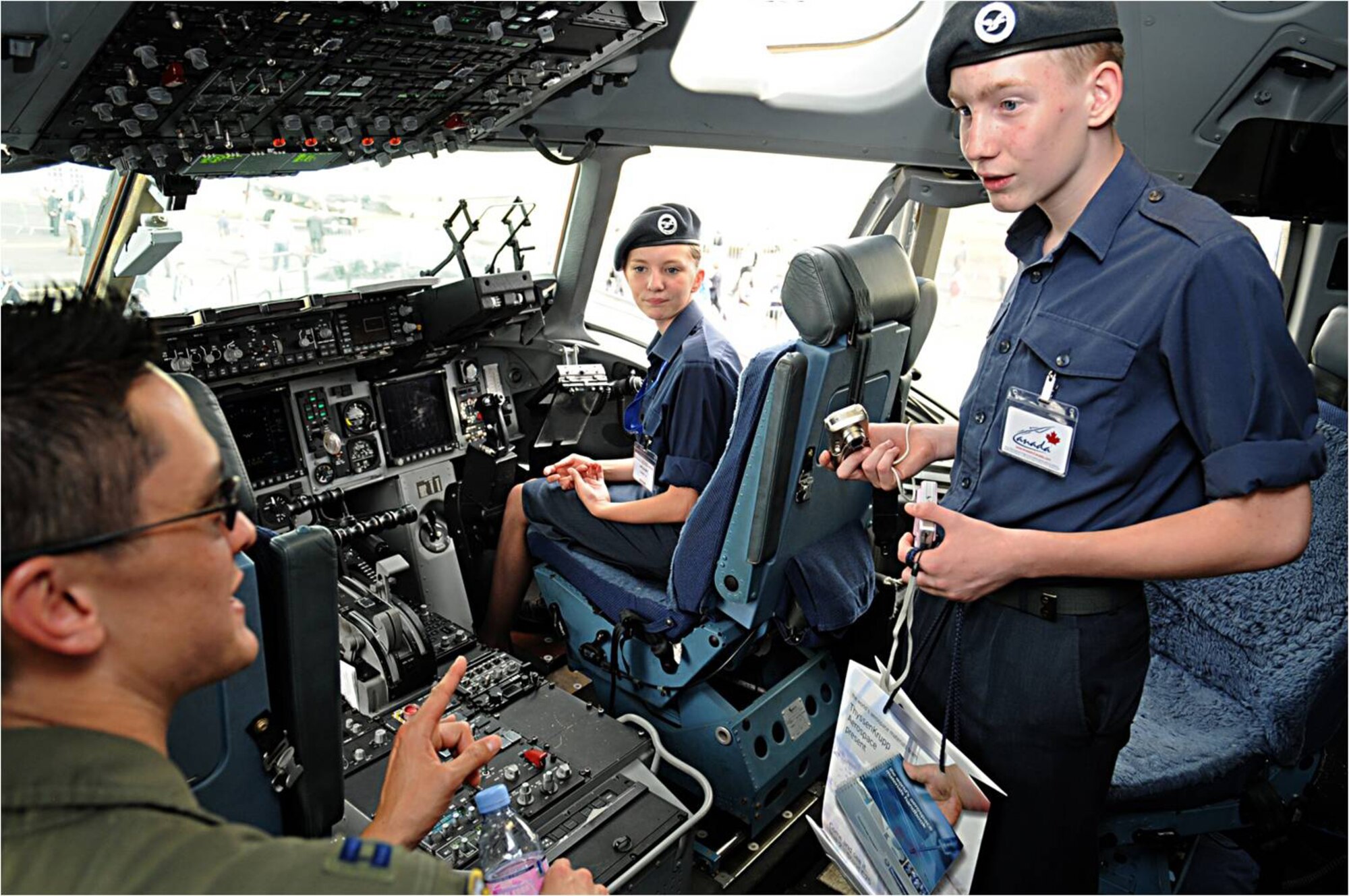 FARNBOROUGH, United Kingdom -- Capt. Gordon Roman, C-17 Globemaster pilot from Travis Air Force Base, Calif., explains cockpit controls to British cadets here July 20.  Eleven U.S. aircraft and approximately 70 military personnel representing all branches of service participate in the 2010 Farnborough International Air Show that takes place July 19-25. (U.S. Air Force photo/Staff Sgt. Jerry Fleshman)

