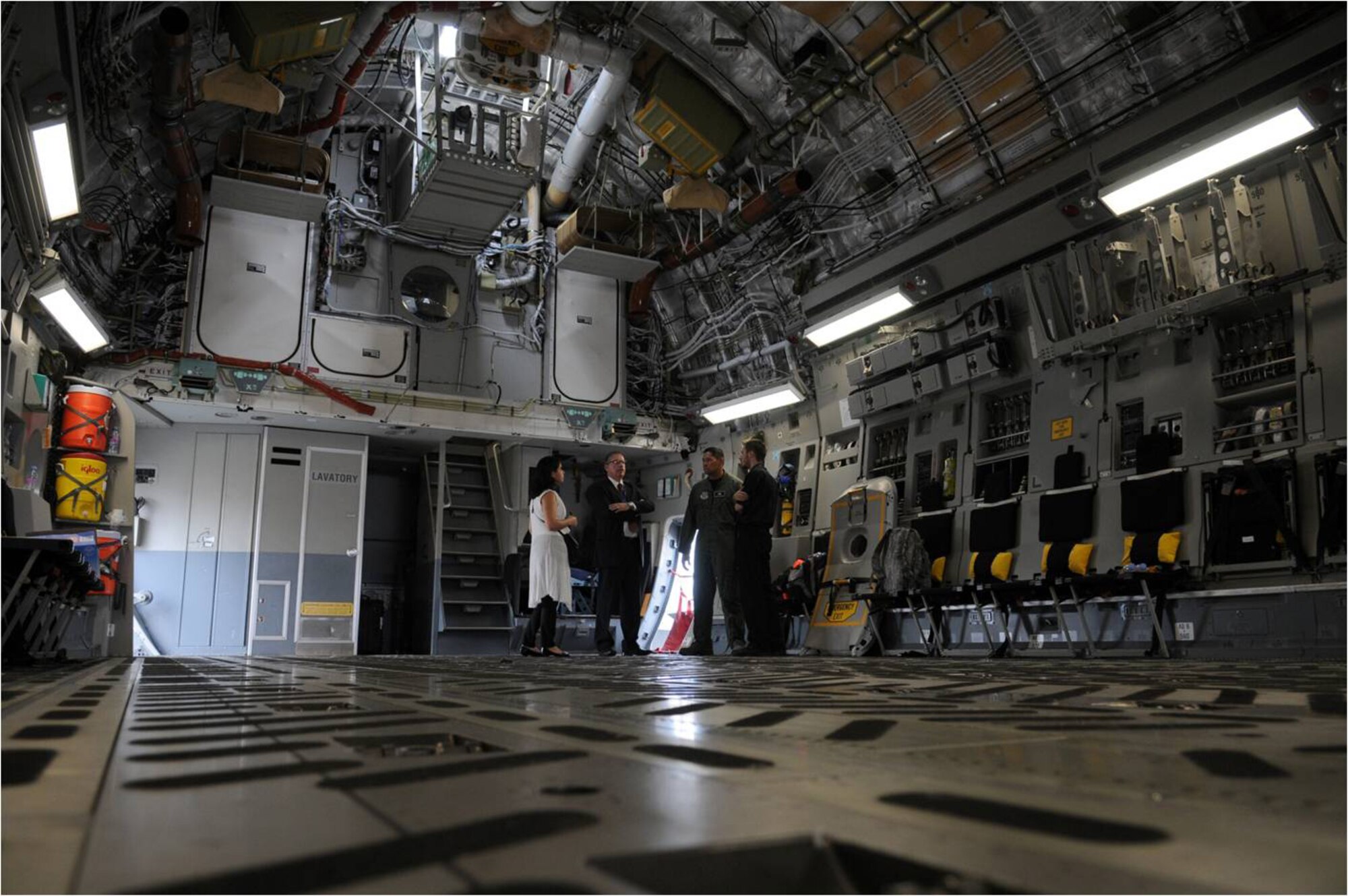 FARNBOROUGH, United Kingdom -- Spectators  tour the cargo bay of a C-17 Globemaster from Travis Air Force Base, Calif., here July 20.  Eleven U.S. military aircraft and approximately 70 personnel representing all branches of service participate in the 2010 Farnborough International Air Show that takes place July 19-25. (U.S. Air Force photo/Staff Sgt. Jerry Fleshman)
