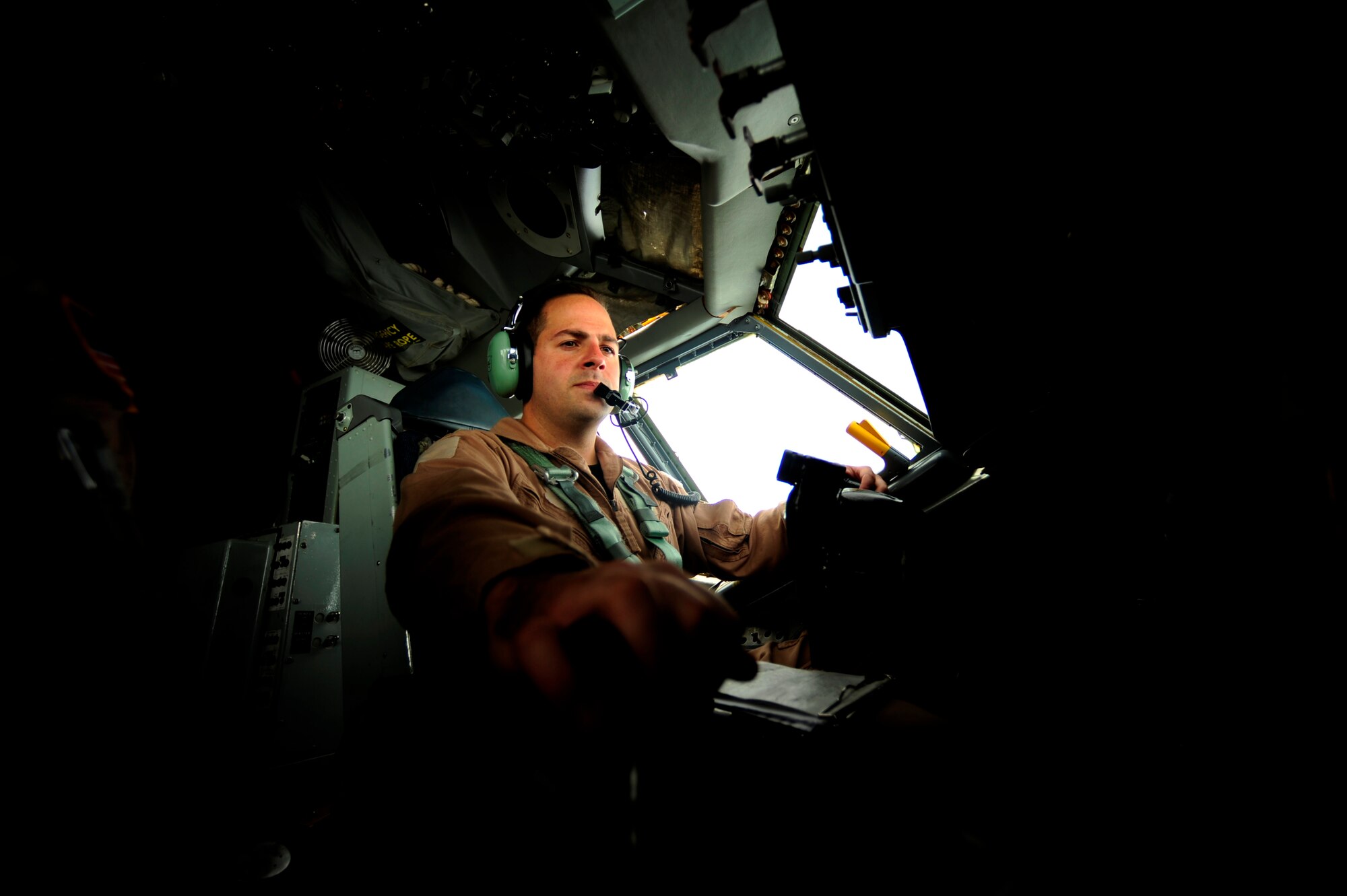 U.S. Air Force Capt. Adam Kornitzer, a KC-135 Stratotanker pilot assigned to the 340th Expeditionary Air Refueling Squadron, goes over pre-flight checklist during a flying mission while deployed to a base in Southwest Asia on July 8, 2010. Coalition tankers have flown greater than 6,000 sorties, offloaded greater than 400 million pounds of fuel and refueled nearly 33,000 aircraft as of June 30, 2010. (U.S. Air Force photo by Staff Sgt. Andy M. Kin / Released)