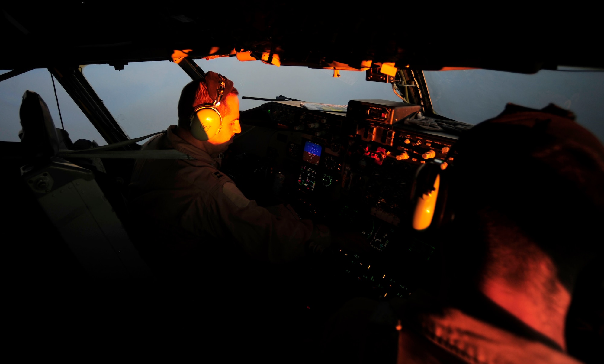 U.S. Air Force Captains Adam Kornitzer, left, and Nicholas Williams, KC-135 Stratotanker pilots assigned to the 340th Expeditionary Air Refueling Squadron, perform checks and stay on course during a refueling mission of a U.S. Marine Corps F-18 Hornet on July 8, 2010. Coalition tankers have flown greater than 6,000 sorties, offloaded greater than 400 million pounds of fuel and refueled nearly 33,000 aircraft as of June 30, 2010. (U.S. Air Force photo by Staff Sgt. Andy M. Kin / Released)