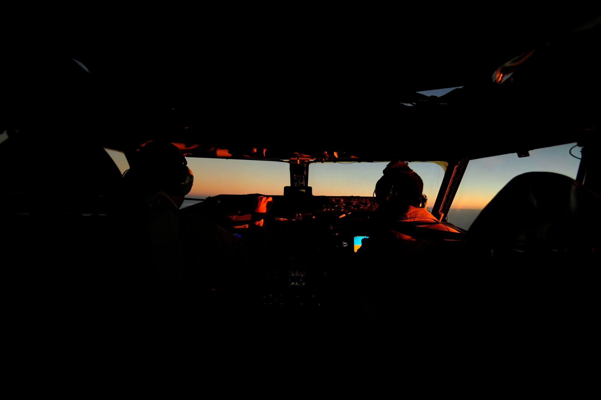 U.S. Air Force Captians Adam Kornitzer, left, and Nicholas Williams, KC-135 Stratotanker pilots assigned to the 340th Expeditionary Air Refueling Squadron, keep the jet steady during an air refueling of a U.S. Marine Corps F-18 Hornet aircraft on July 8, 2010.(U.S. Air Force photo by Staff Sgt. Andy M. Kin / Released)  