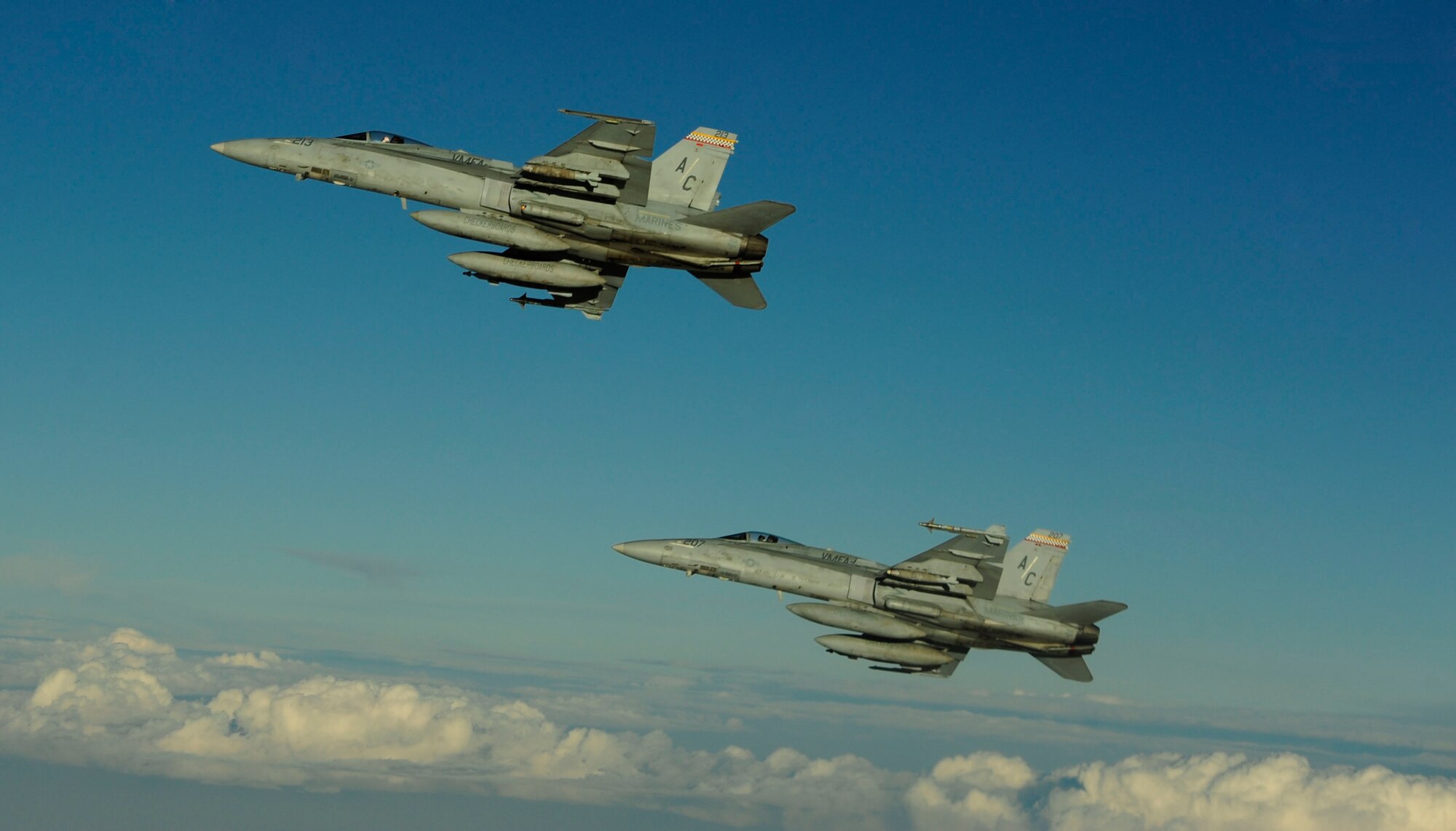 Two U.S. Marine Corps F-18 Hornets fly by after getting fuel from a KC-135 Stratotanker assigned to the 340th Expeditionary Air Refueling Squadron over Afghanistan on July 8, 2010. Coalition tankers have flown greater than 6,000 sorties, offloaded greater than 400 million pounds of fuel and refueled nearly 33,000 aircraft as of June 30, 2010. (U.S. Air Force photo by Staff Sgt. Andy M. Kin / Released)