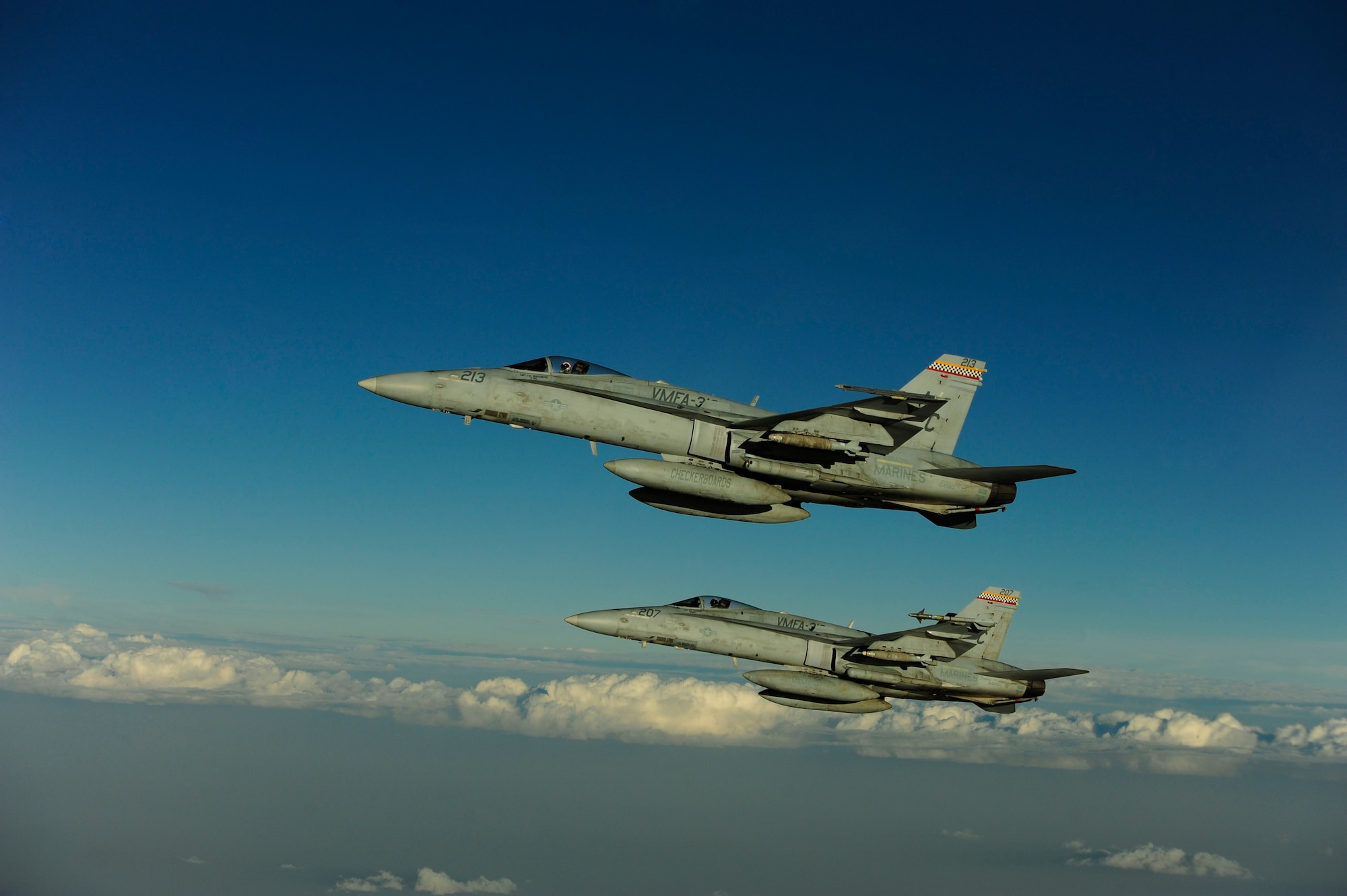 Two U.S. Marine Corps F-18 Hornets fly by after getting fuel from a KC-135 Stratotanker assigned to the 340th Expeditionary Air Refueling Squadron over Afghanistan on July 8, 2010. Coalition tankers have flown greater than 6,000 sorties, offloaded greater than 400 million pounds of fuel and refueled nearly 33,000 aircraft as of June 30, 2010. (U.S. Air Force photo by Staff Sgt. Andy M. Kin / Released)