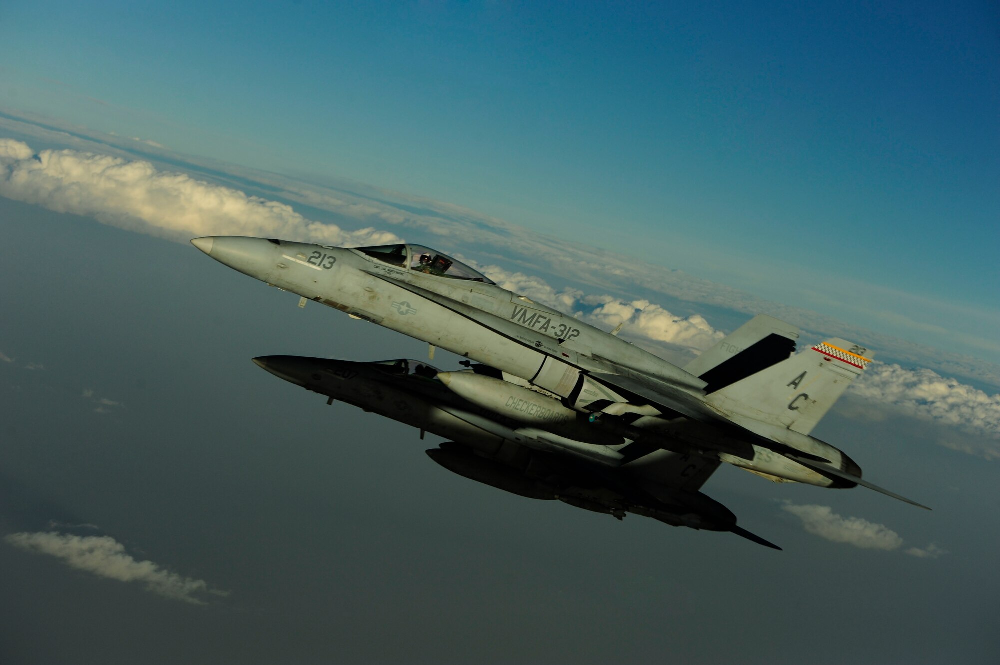 Two U.S. Marine Corps F-18 Hornets fly by after getting fuel from a KC-135 Stratotanker assigned to the 340th Expeditionary Air Refueling Squadron over Afghanistan on July 8, 2010. Coalition tankers have flown greater than 6,000 sorties, offloaded greater than 400 million pounds of fuel and refueled nearly 33,000 aircraft as of June 30, 2010. (U.S. Air Force photo by Staff Sgt. Andy M. Kin / Released)