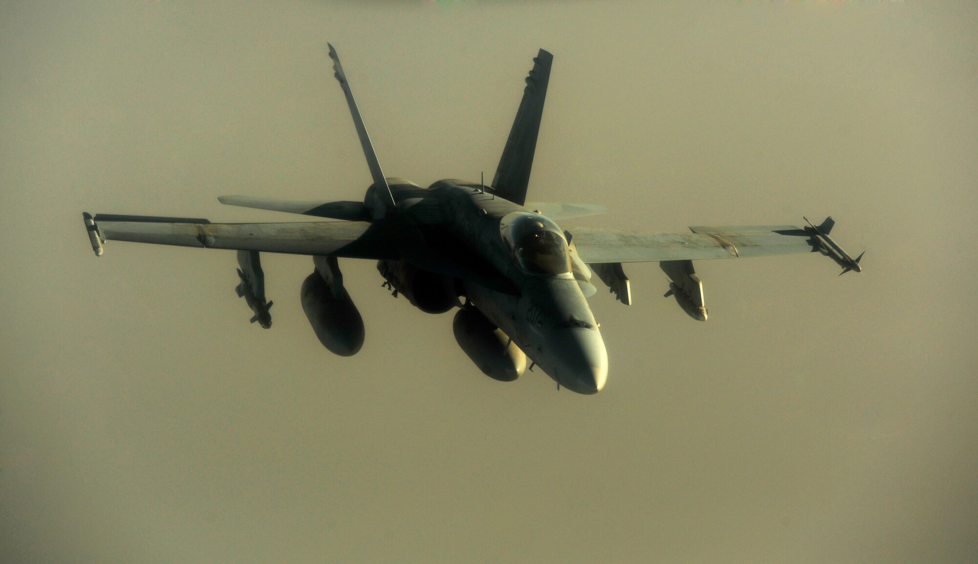 A U.S. Marine Corps F-18 Hornet flies over the skies of Afghanistan after refueling with a KC-135 Stratotanker on July 8, 2010. Coalition tankers have flown greater than 6,000 sorties, offloaded greater than 400 million pounds of fuel and refueled nearly 33,000 aircraft as of June 30, 2010. (U.S. Air Force photo by Staff Sgt. Andy M. Kin / Released)