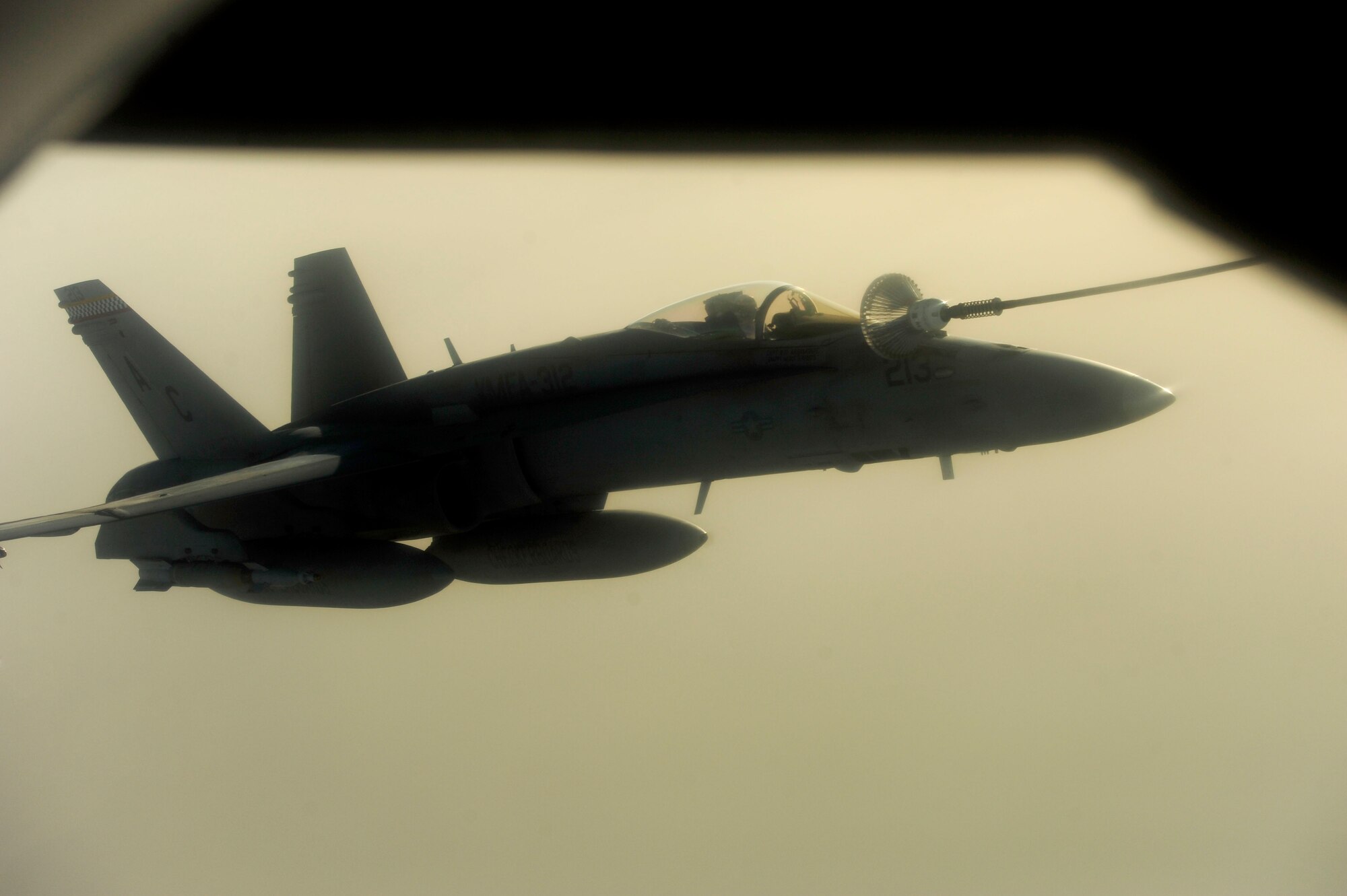 A U.S. Marine Corps F-18 Hornet refuels with a KC-135 Stratotanker assigned to the 340th Expeditionary Air Refueling Squadron over Afghanistan on July 8, 2010. The 340th EARS is deployed to a base in Southwest Asia. Coalition tankers have flown greater than 6,000 sorties, offloaded greater than 400 million pounds of fuel and refueled nearly 33,000 aircraft as of June 30, 2010. (U.S. Air Force photo by Staff Sgt. Andy M. Kin / Released)