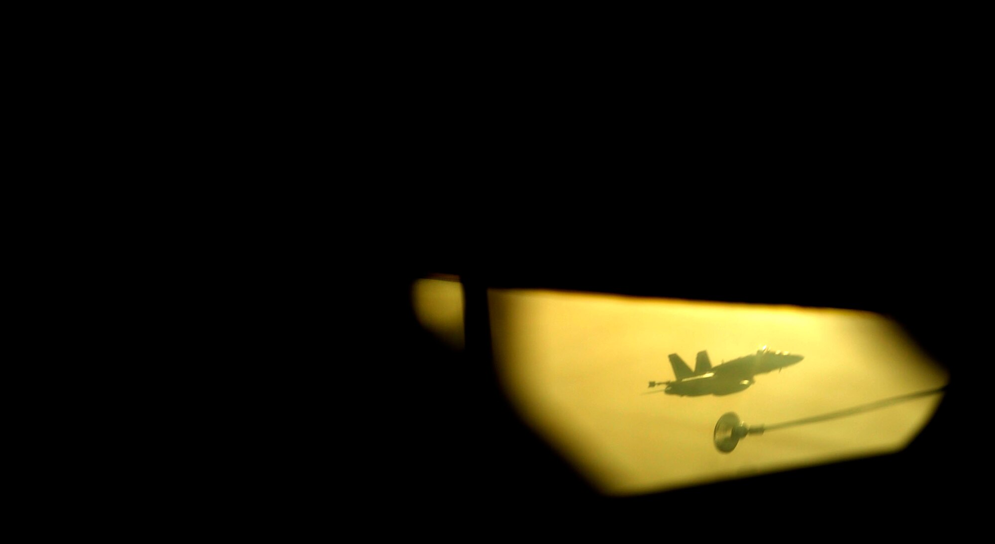 A U.S. Marine Corps F-18 Hornet refuels with a KC-135 Stratotanker assigned to the 340th Expeditionary Air Refueling Squadron over Afghanistan on July 8, 2010. The 340th EARS is deployed to a base in Southwest Asia. Coalition tankers have flown greater than 6,000 sorties, offloaded greater than 400 million pounds of fuel and refueled nearly 33,000 aircraft as of June 30, 2010. (U.S. Air Force photo by Staff Sgt. Andy M. Kin / Released)