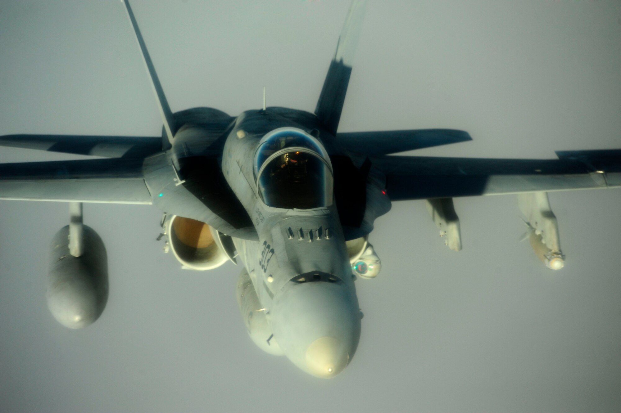 A U.S. Marine Corps F-18 Hornet flies over the skies of Afghanistan after refueling with a KC-135 Stratotanker on July 8, 2010. Coalition tankers have flown greater than 6,000 sorties, offloaded greater than 400 million pounds of fuel and refueled nearly 33,000 aircraft as of June 30, 2010. (U.S. Air Force photo by Staff Sgt. Andy M. Kin / Released)