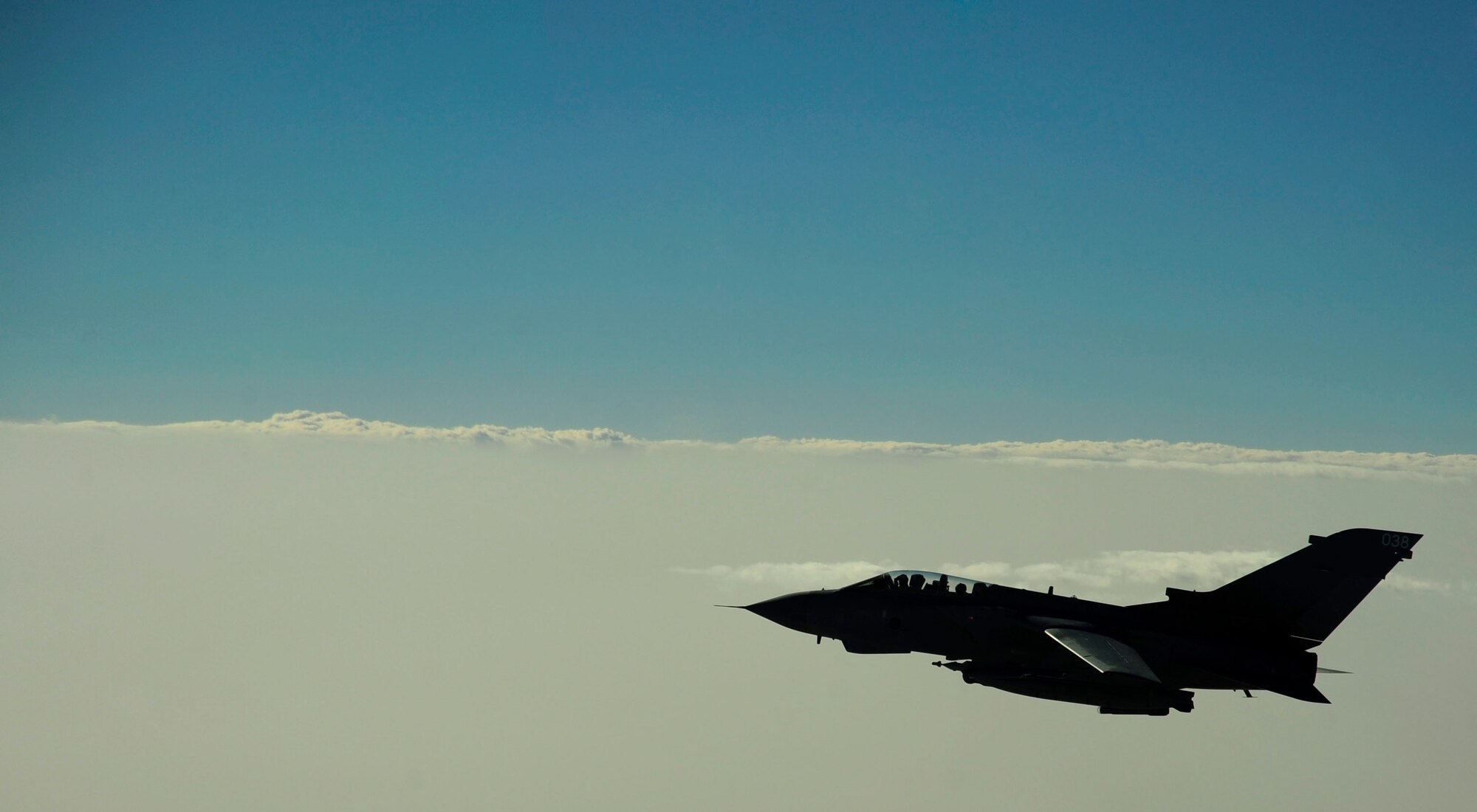 A U.S. Marine Corps F-18 Hornet flies over the skies of Afghanistan after refueling with a KC-135 Stratotanker on July 8, 2010. Coalition tankers have flown greater than 6,000 sorties, offloaded greater than 400 million pounds of fuel and refueled nearly 33,000 aircraft as of June 30, 2010. (U.S. Air Force photo by Staff Sgt. Andy M. Kin / Released)