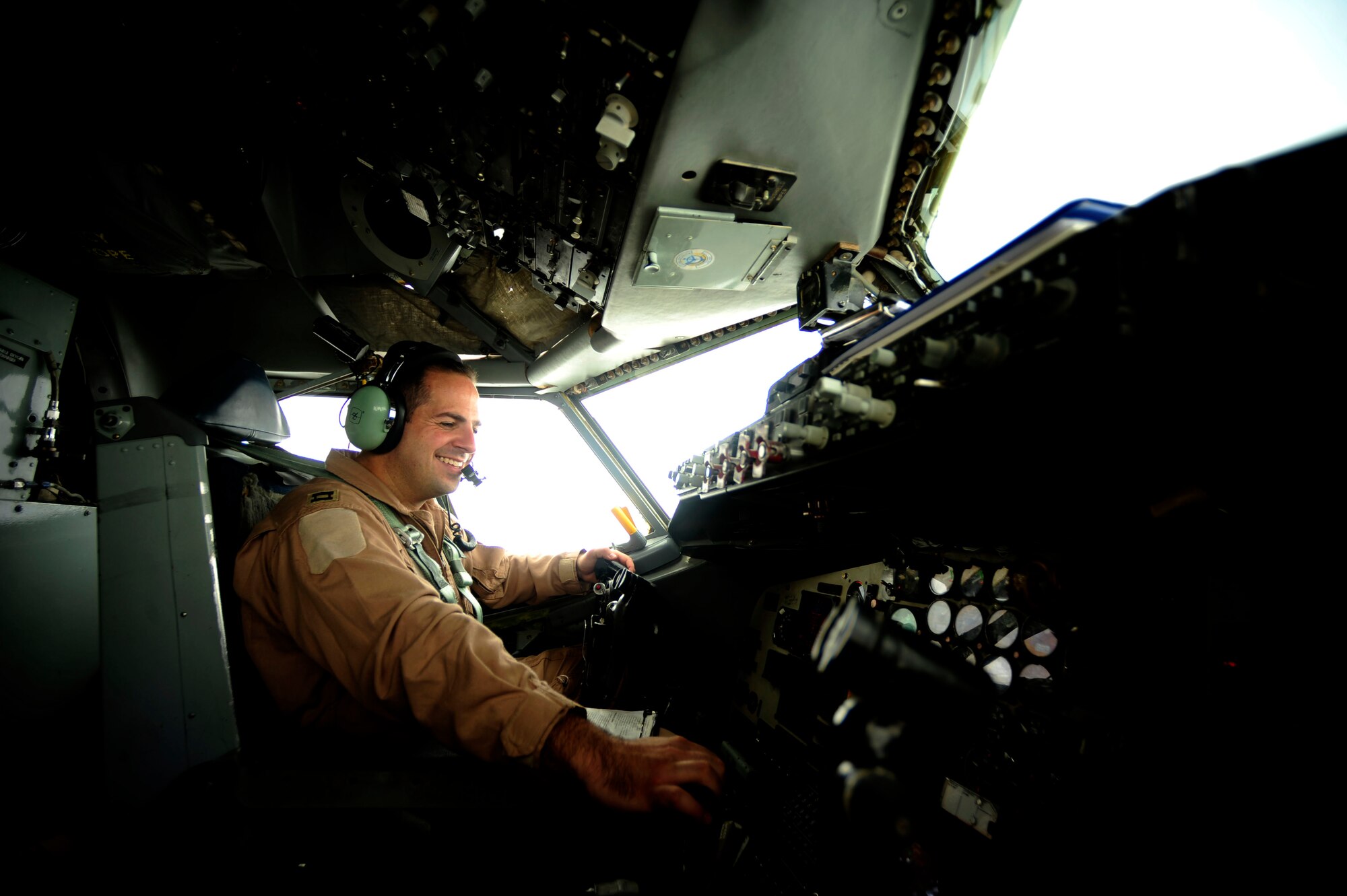 U.S. Air Force Capt. Adam Kornitzer a KC-135 Stratotanker pilot assigned to the 340th Expeditionary Air Refueling Squadron, smiles for the camera during pre-flight checks prior to a flying mission over Afghanistan while deployed to a base in Southwest Asia on July 8, 2010. Coalition tankers have flown greater than 6,000 sorties, offloaded greater than 400 million pounds of fuel and refueled nearly 33,000 aircraft as of June 30, 2010. (U.S. Air Force photo by Staff Sgt. Andy M. Kin / Released)