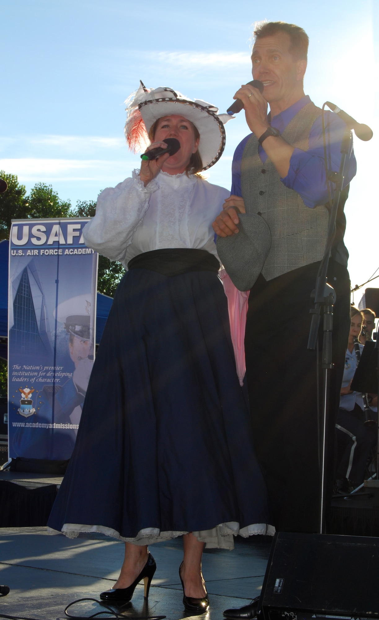 Tech. Sgt. Nancy Poffenbarger and Master Sgt. Randall Ward perform "Mary Poppins Medley" during an Air Force Academy Band concert in Castle Rock, Colo., July 21, 2010. The Academy Band's performance was the first of Castle Rock's 2010 Music in the Meadows series. (U.S. Air Force photo/Staff Sgt. Don Branum)