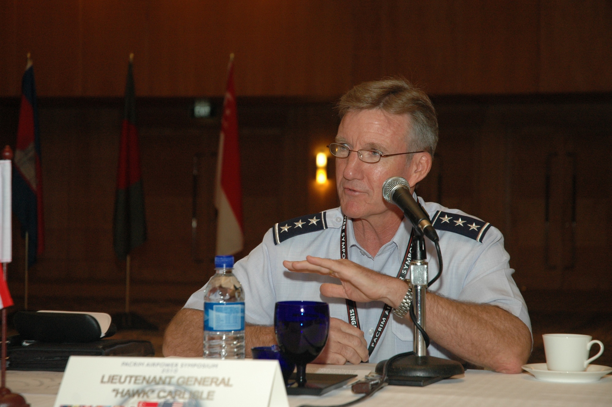 Lt. Gen. Hawk Carlisle, 13th Air Force commander, welcomes delegations from 24 Asia-Pacific nations during the Pacific Rim Airpower Symposium July 21 in Singapore. The annual symposium encourages relationship building and enhances cooperation among the air forces of Asia-Pacific nations. This year's symposium theme, “The Role of Airpower in Peace Support Operations,” aims to help participants from 24 nations better understand how air forces can support peace-keeping missions in the region. (Courtesy photo by Joshua Lok, Singapore Air Force)  
 
