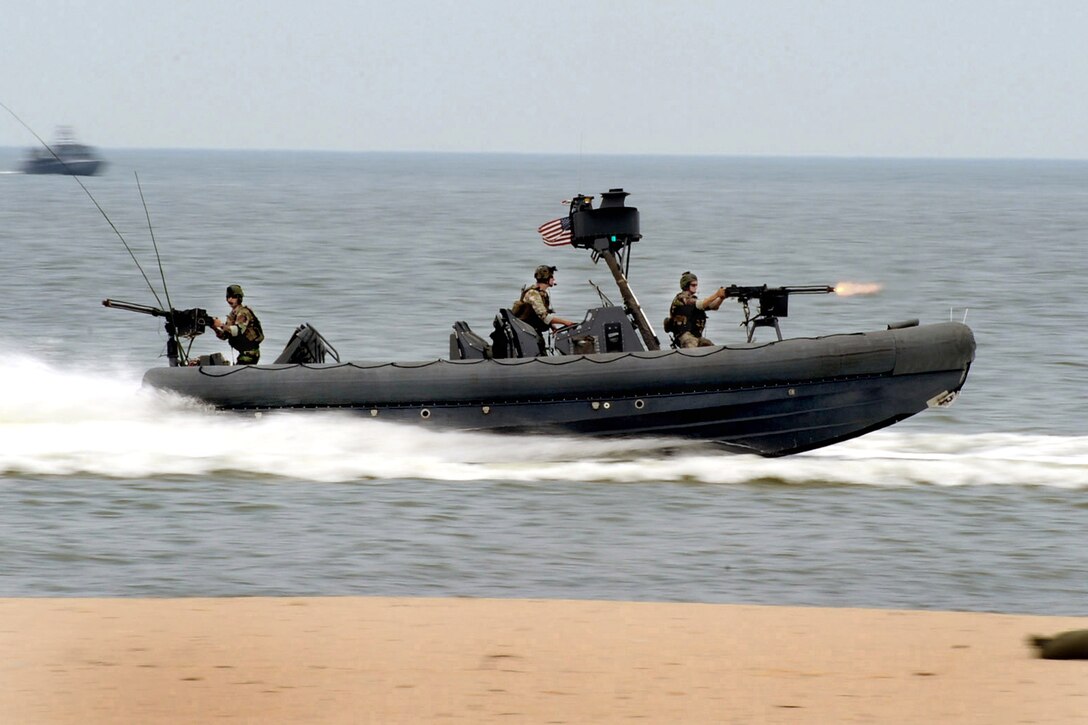 U.S. Navy Special Warfare Combatant-craft Crewmen assigned to Special Boat Team 20 perform a capability demonstration on Joint Expeditionary Base Little Creek-Fort Story, Virginia Beach, Va., July 17, 2010.