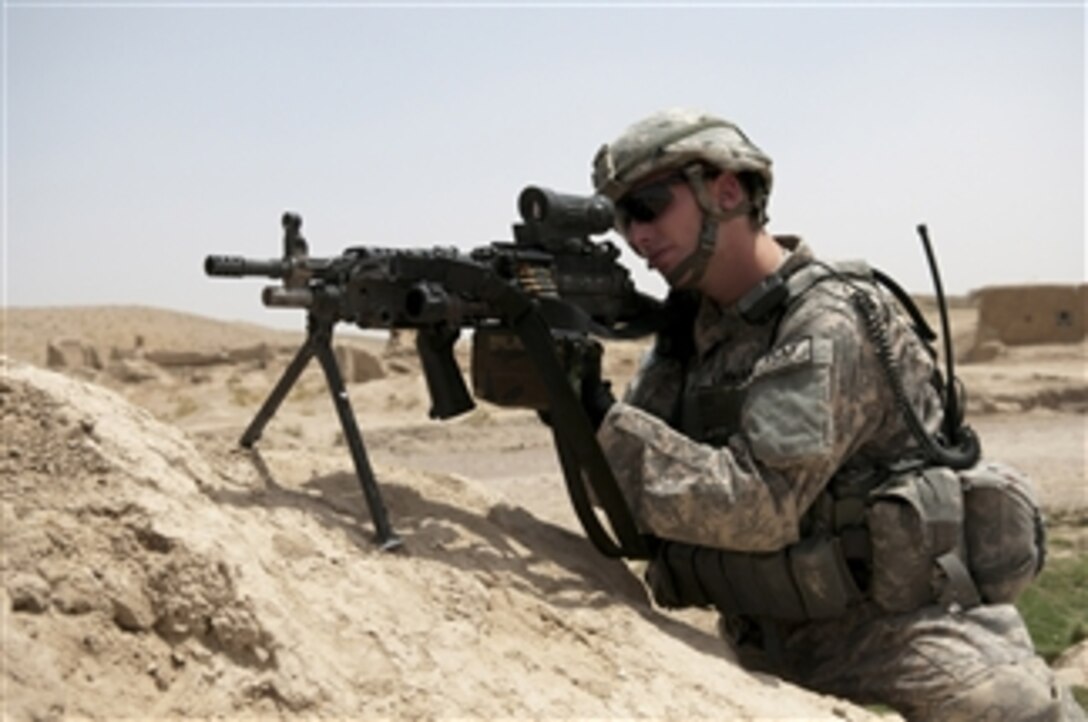 U.S. Army Cpl. Daniel Lehman, a rifleman with Provincial Reconstruction Team Zabul, provides security during a shura at a village in the Zabul province of Afghanistan on July 19, 2010.  