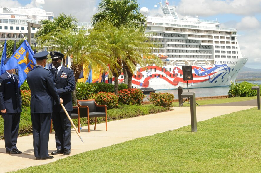 JOINT BASE PEARL HARBOR HICKAM, Hawaii – Lt. Col. Brian Hill recieves the 96th Air Refueling Squadron guide on as a cruise ship passes by Pearl Harbor during the reactivation of the 96th ARS ceremony here, 23 July. The 15th Wing reactivated the 96th ARS here at an assumption of command ceremony as a Total Force Integration active partnership with the Hawaii National Guard. Squadron responsibilities were assumed by Colonel Hill, previously serving as the 15th Wing safety officer. (U.S. Air Force photo/Senior Airman Gustavo Gonzalez)