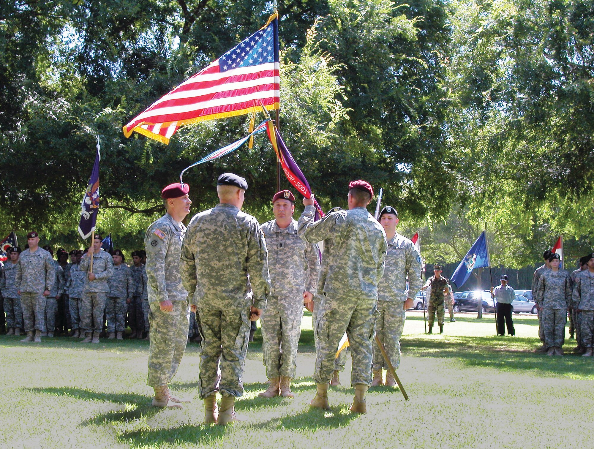 Col. Robert Crowley, outgoing commander of the 358th Civil Affairs Brigade, right, relinquishes the brigade flag in a change of command ceremony 26 at LeMay Park. Gen. Gary Medvigy, Commanding General, 351st Civil Affairs Command, was the presiding officer. Col. Martin Badegian, left, assumed command of the brigade. Civil affairs units help military commanders by working with civil authorities and civilian populations in the commander’s area of operations to lessen the impact of military operations during peace time, contingency operations and declared war. The 351st Civil Affairs Command is part of the U.S. Army Civil Affairs & Psychological Operations Command (Airborne) based at Fort Bragg, N.C. (U.S. Air Force photo by Maj. Donald Traud) 
