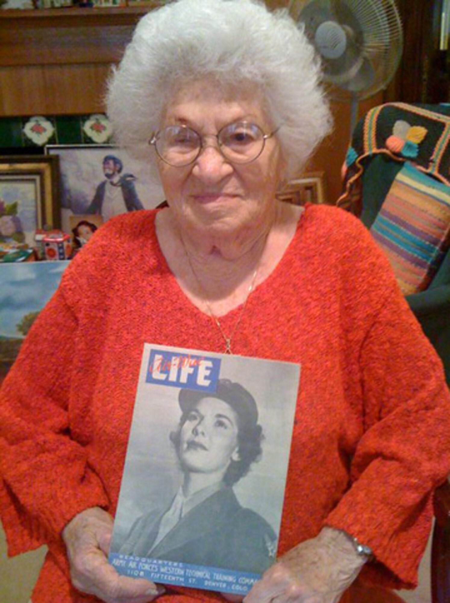 Bea Cohen, 100, holds a copy of “Life Magazine” from the 1940’s. While not a photo of her, the photo story inside depicts the life of women in the military during WW II.  (Photo by Lt. Mara Title)