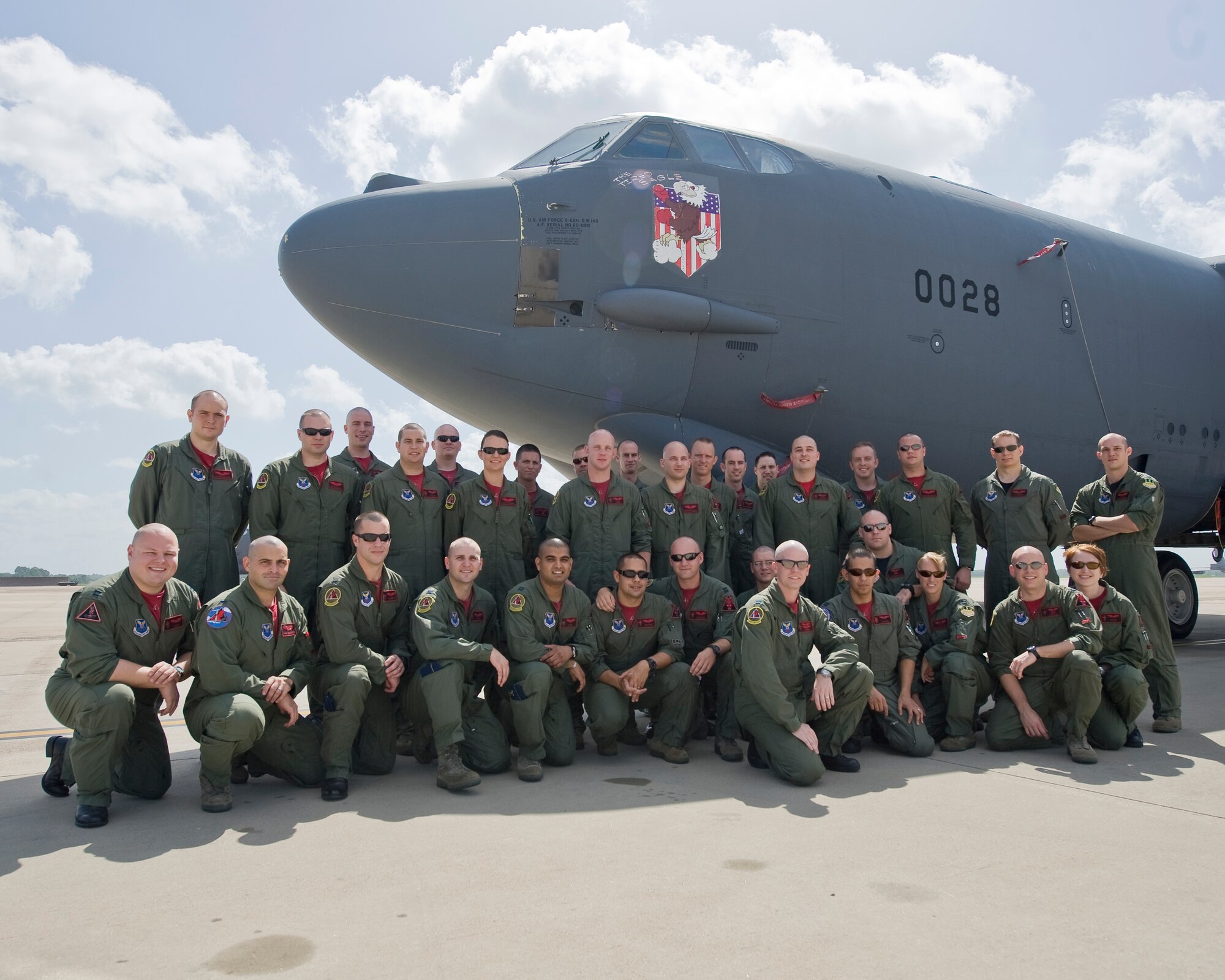 BARKSDALE AIR FORCE BASE, La. -- Capt. Eric Schmidt (front), a B-52 pilot with the 96th Bomb Squadron, poses with several other Airmen from his squadron July 23. Captain Schmidt is undergoing chemotherapy for stomach cancer, and several fellow Airmen shaved their heads to show their support. (U.S. Air Force photo by Senior Airman Chad Warren) (RELEASED)