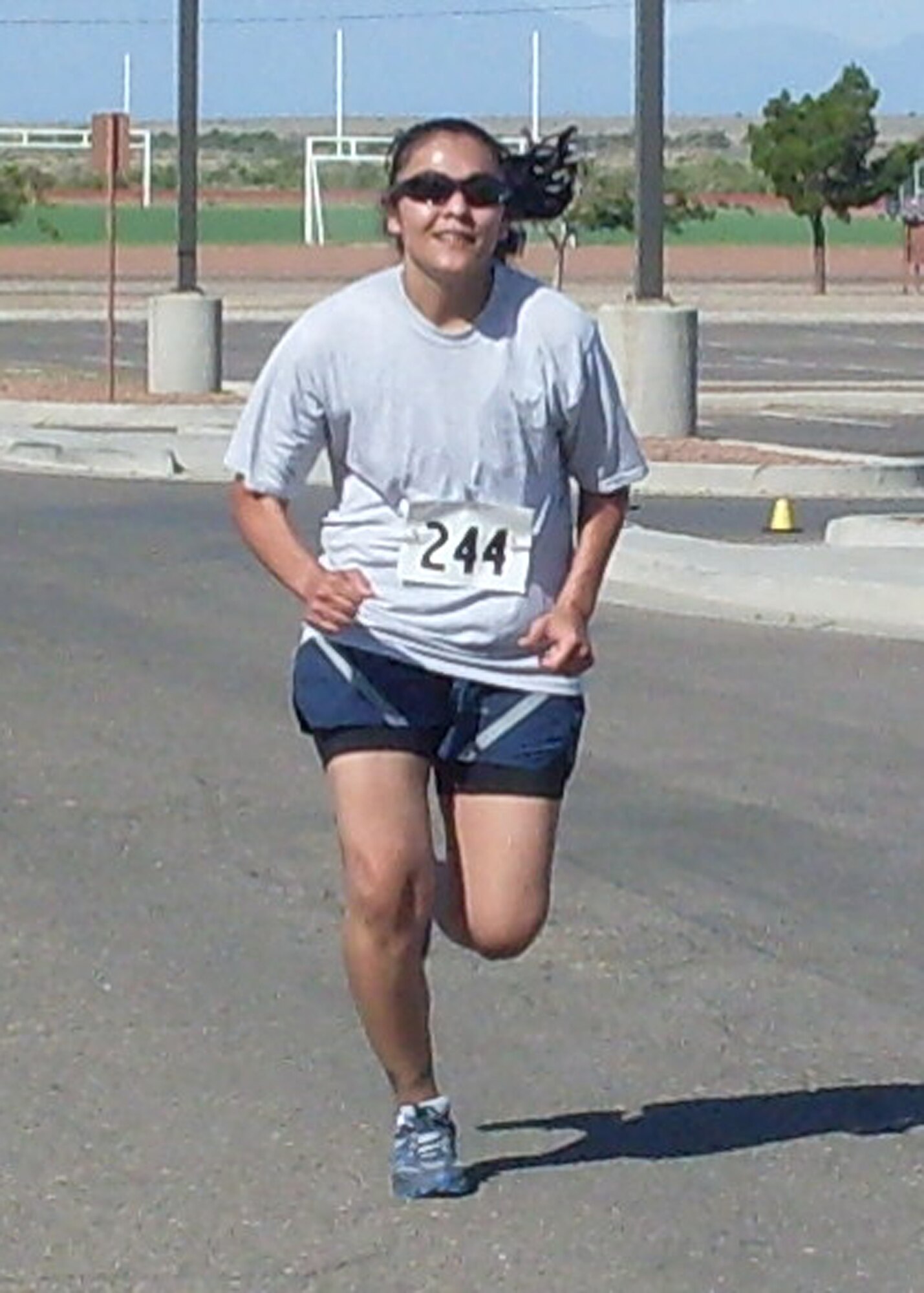 HOLLOMAN AIR FORCE BASE, N.M. -- Staff Sgt. Liz Duran, 49th Logistics Readiness Squadron, sprints to the finish line during the Half Marathon at the Domenici Fitness and Sports Center July 17, 2010. Sergeant Duran finished in second place in the women's category of the 13.2 mile race. (Courtesy photo)