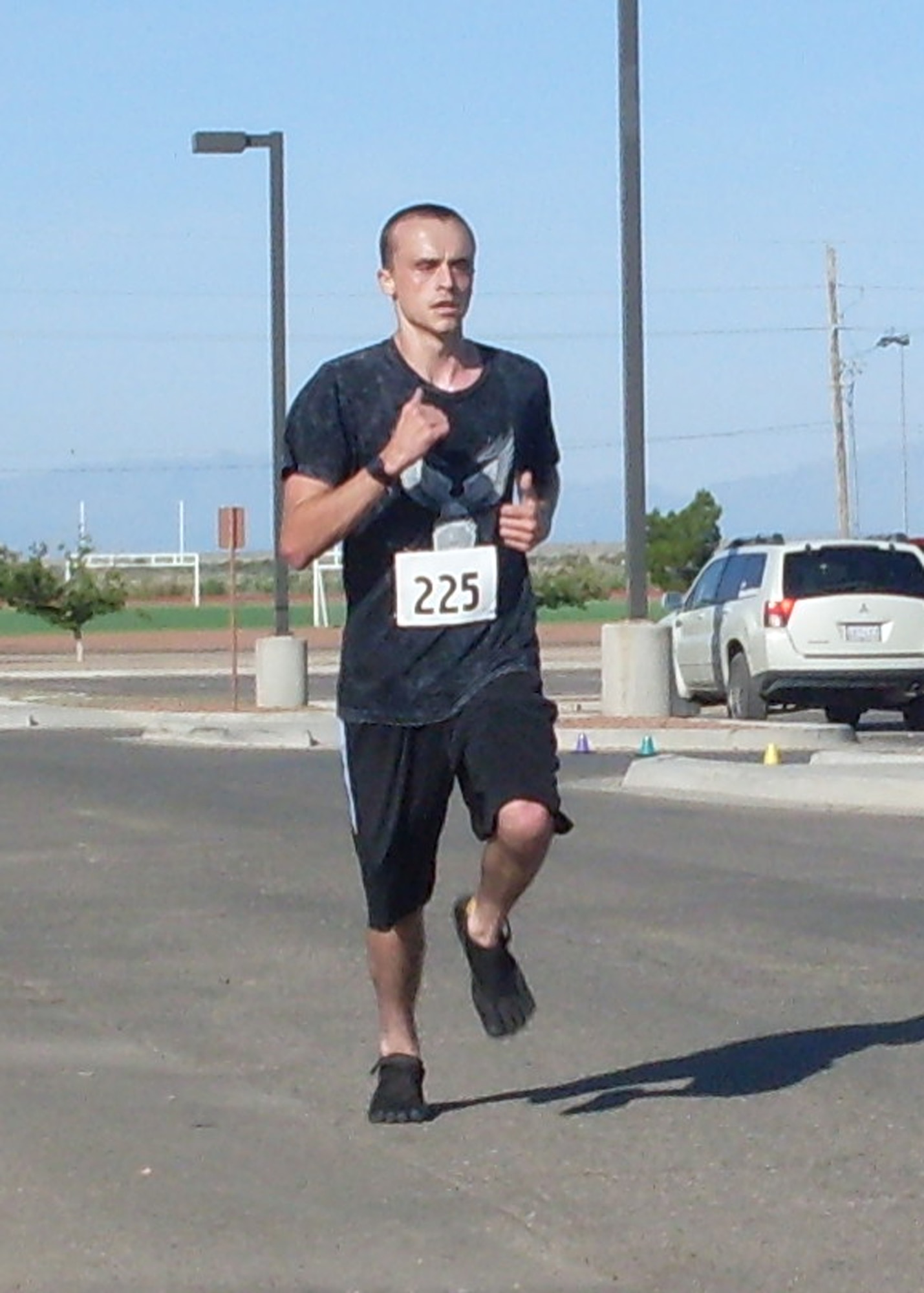 HOLLOMAN AIR FORCE BASE, N.M. -- Airman 1st Class Dustin Hove, 49th Maintenance Squadron, sprints to the finish line during the Half Marathon at the Domenici Fitness and Sports Center July 17, 2010. Airman Hove finished in third place in the men's category of the 13.2 mile race. (Courtesy photo)