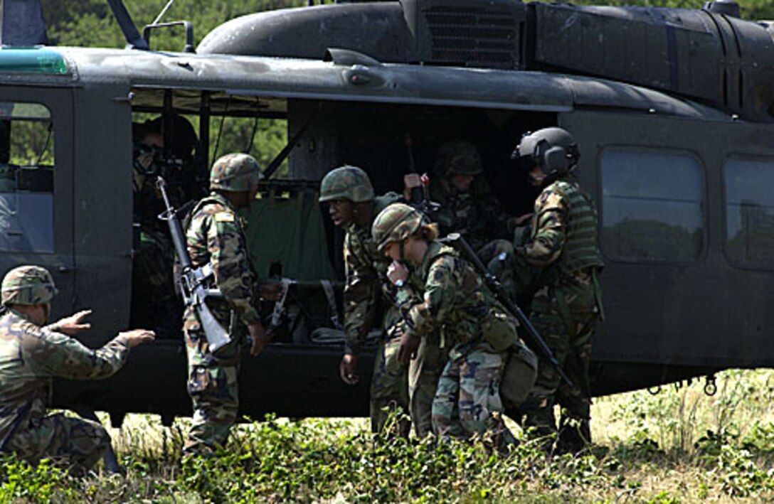 U.S. National Guard troops prepare to board an Arkansas National Guard UH-1H helicopter used in a Medevac mission at Fort McCoy, Wis., July 15, 2005, during the Patriot exercise. U.S. Air Force photo by Tech. Sgt. Todd A. Pendleton