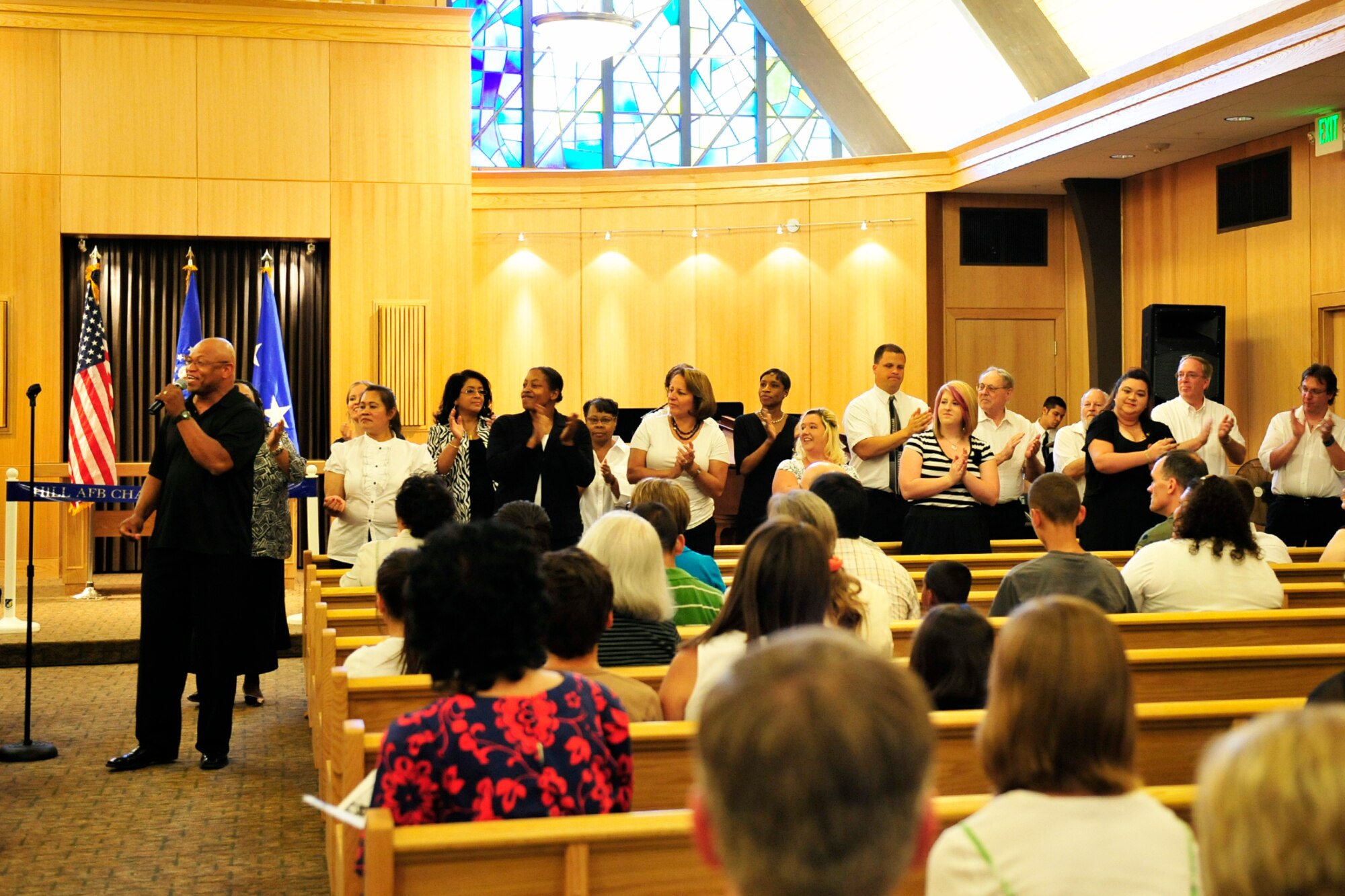 The Hill Air Force Base choir sings "Sanctuary, Lord Prepare Me," as special music during the rededication ceremony July 16 in the Hill Chapel. (Air Force photo by: Kim Cook)