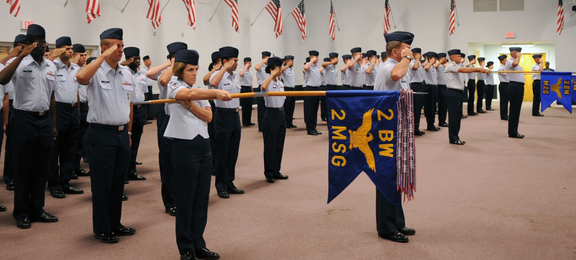BARKSDALE AIR FORCE BASE, La. -- Members of the 2d Bomb Wing render their first salute to Col. Timothy Fay, 2d BW commander. Col. Steven Basham relinquished command to Colonel Fay July 19 during the change of command ceremony at Hoban Hall. (U.S. Air Force photo by Senior Airman La'Shanette V. Garrett)(RELEASED)
