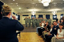 OFFUTT AIR FORCE BASE, Neb. -  Lt. Col. Jenifer B.E. Warren, 55th Intelligence Support Squadron commander, receives her first salute as a commander July 22 from members of the 55th Operations Group as part of a special ceremony at the Patriot Club. The ISS was activated as a part of the 55th Operations Group as a support function for intelligence operations. U.S. Air Force photo by Charles Haymond