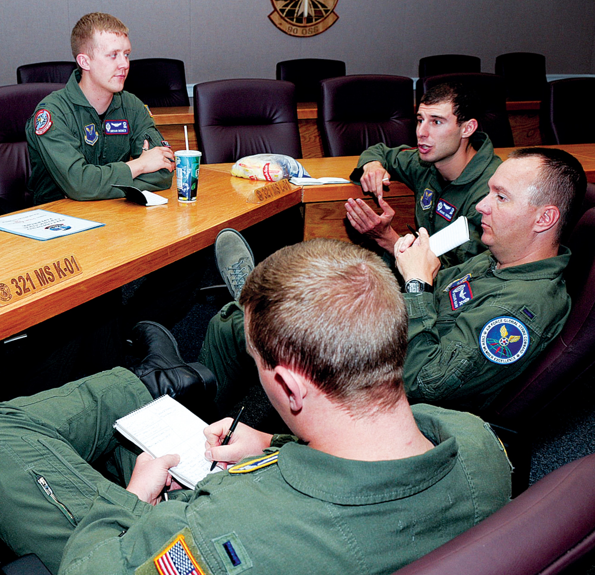 90th Operations Group trainers conduct a meet and greet during a
Global Strike Challenge team introduction meeting July 12. The trainers are
1st Lt. Brian Boner, 1st Lt. Michael Sherman, and 1st Lt. Michael Ralph, all
from the 319th Missile Squadron; and 1st Lt. Avery Snyder, 320th Missile
Squadron. (U.S. Air Force photo by Gerald Teano)