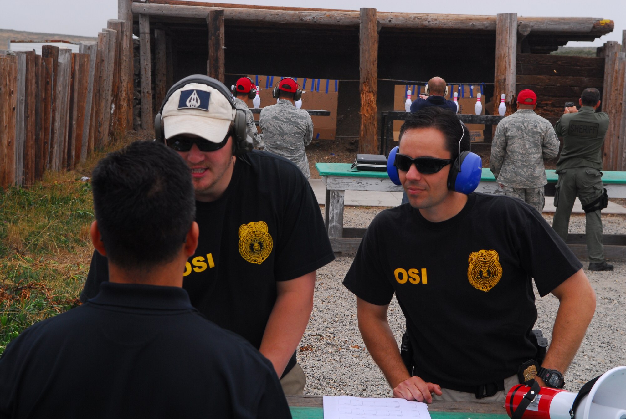 VANDENBERG AIR FORCE BASE, Calif. – Special Agent Wil Thompson, the Air Force Office of Special Investigations, Detachment 804 commander, and Special Agent Randall Adams, who is assigned to Detachment 804, help participants from local law enforcement agencies register for the detachment’s 3rd Annual Bowling Pin Shoot at the Rod and Gun Club here Friday, July 23, 2010. (U.S. Air Force photo/Senior Airman Steve Bauer)