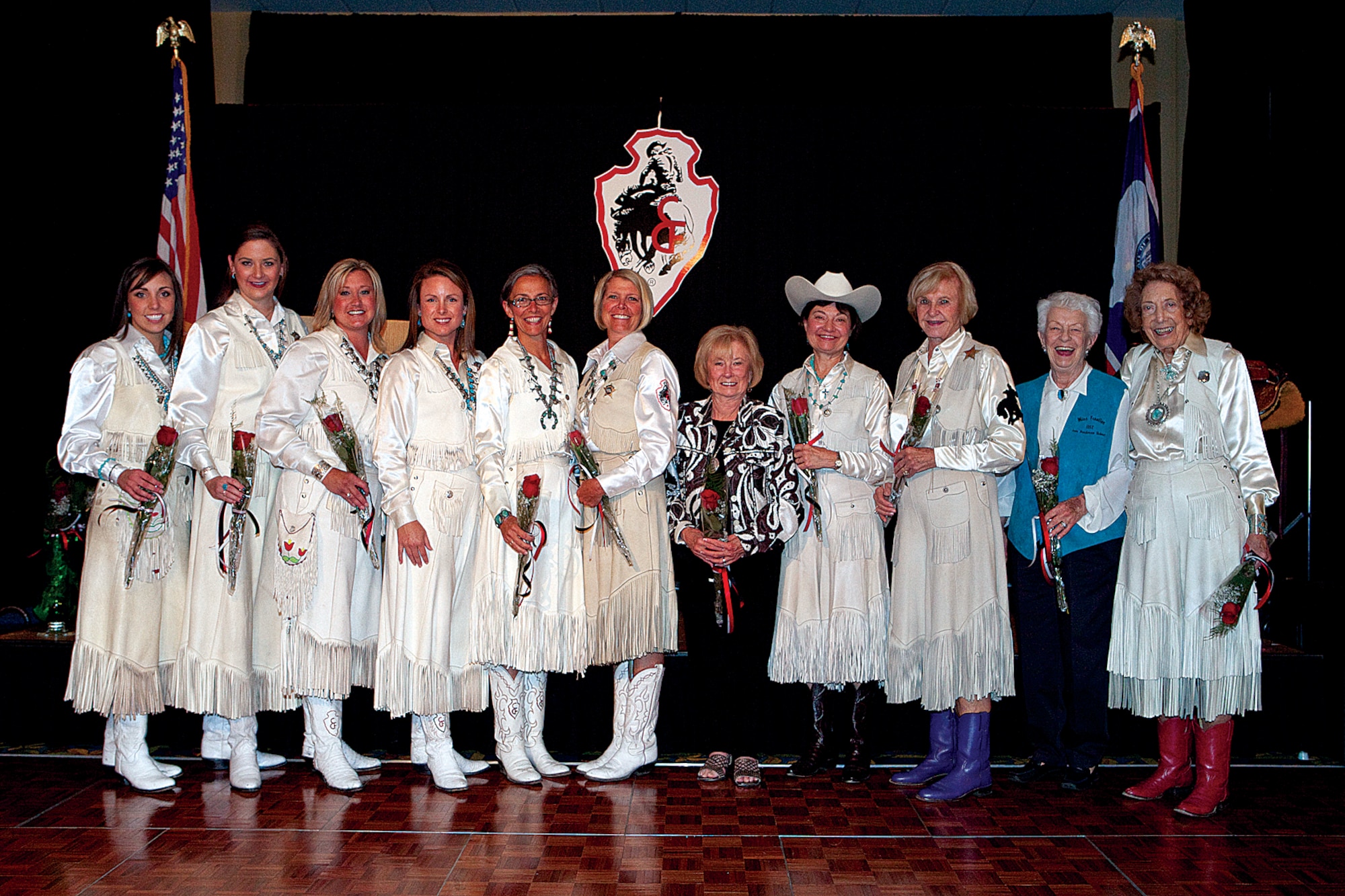 Former Miss Frontiers pose for a group photo during the coronation ball held in Cheyenne's Holiday Inn on July 18. The coronation ball has been a CFD tradition for more than 70 years. (U.S. Air Force photo by Jeff Allred)