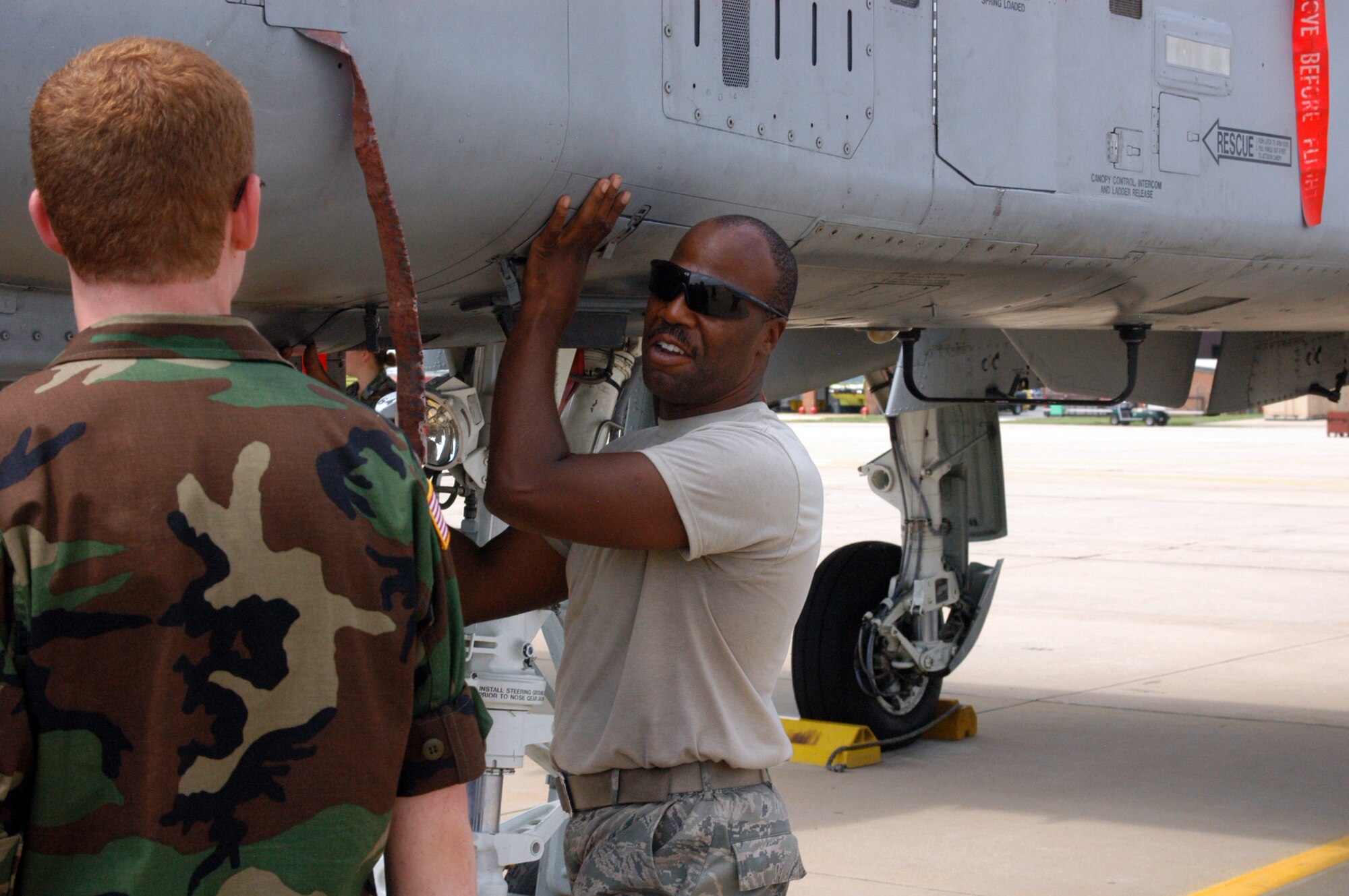 Tech Sgt. Antonio "Tony" Queen, a Crew Chief from the 175th Maintenance Squadron took time out of his day to provide a static display of the A-10C at Warfield Air National Guard Base, Baltimore Md. This was one of the many activities during the seven-day basic training for the 2010 Tri-Wing Encampment. (CAP Photo)