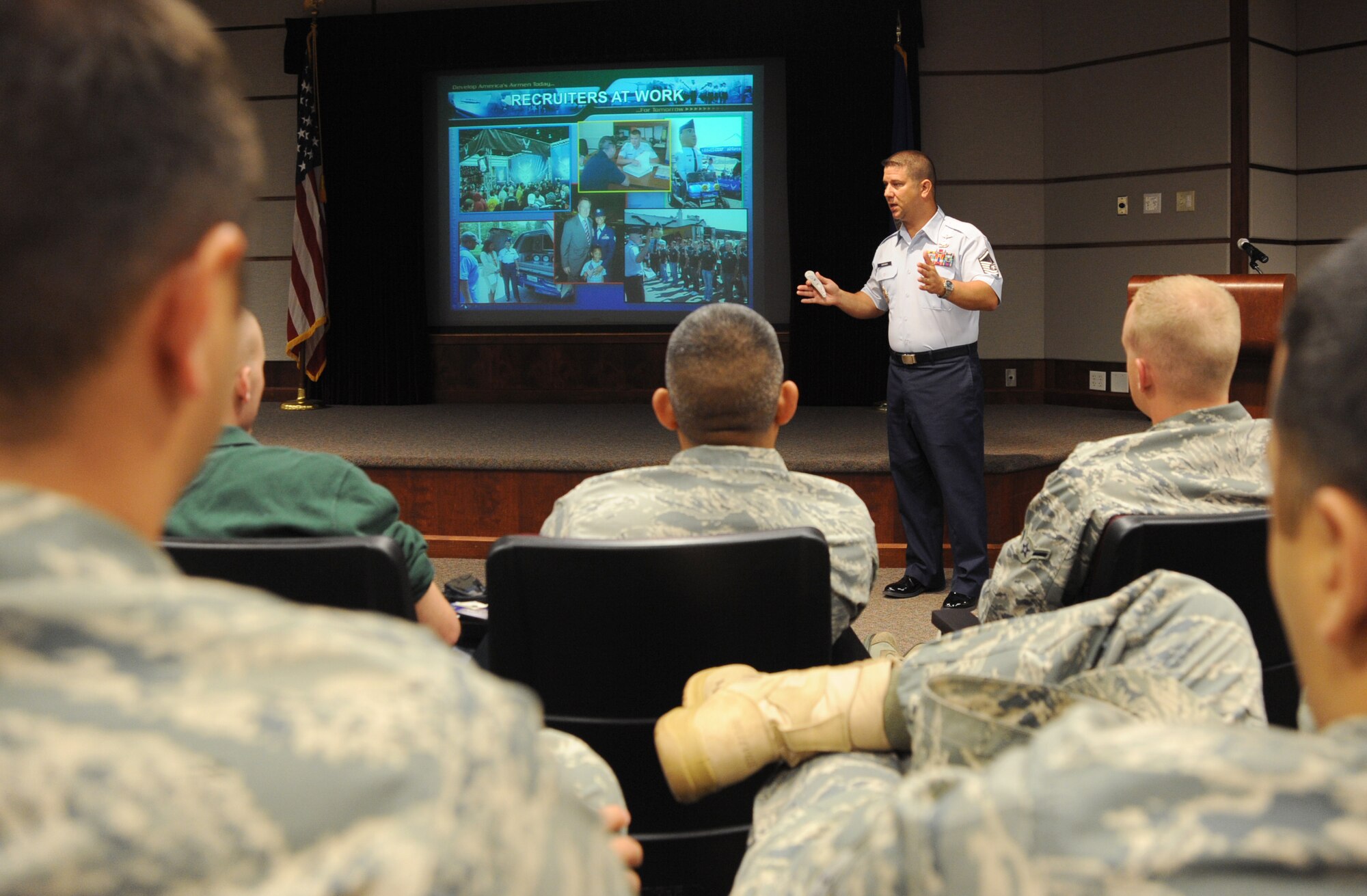 Master Sgt. Wildon Scrivner, USAF Recruiter Screening team member, speaks to Team McConnell members about the benefits and requirements as an Air Force recruiter during the Air Education and Training Command special duty briefing July 22, 2010, McConnell Air Force Base, Kan.  The AETC special duty team briefed Airmen on how to become a recruiter, military training leader and military training instructor.  The team travels to Air Force bases worldwide to share information and dispel rumors about special duty assignments.  (U.S. Air Force photo/Senior Airman Maria Ruiz)