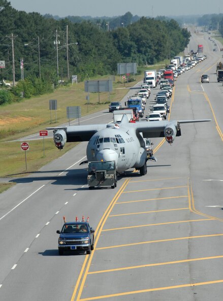 A C-130 makes its way to the Museum of Aviation. The aircraft will be used to train mechanics for the 402nd Maintenance Wing.  U.S. Air Force photo by Claude Lazzara.