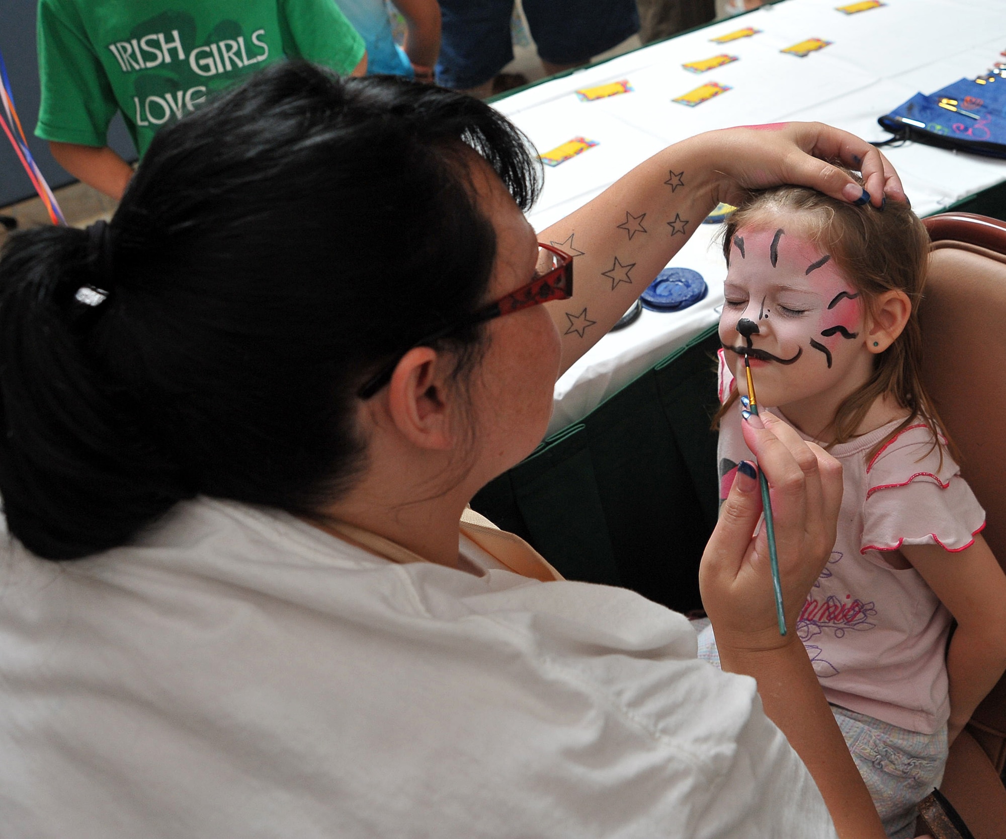 Face painting was one of the many activities children could participate in Friday during the Family Day event at Horizons. It was the final Year of the Air Force Family campaign event, as the campaign ends July 31.  U.S. Air Force photo by Tommie Horton