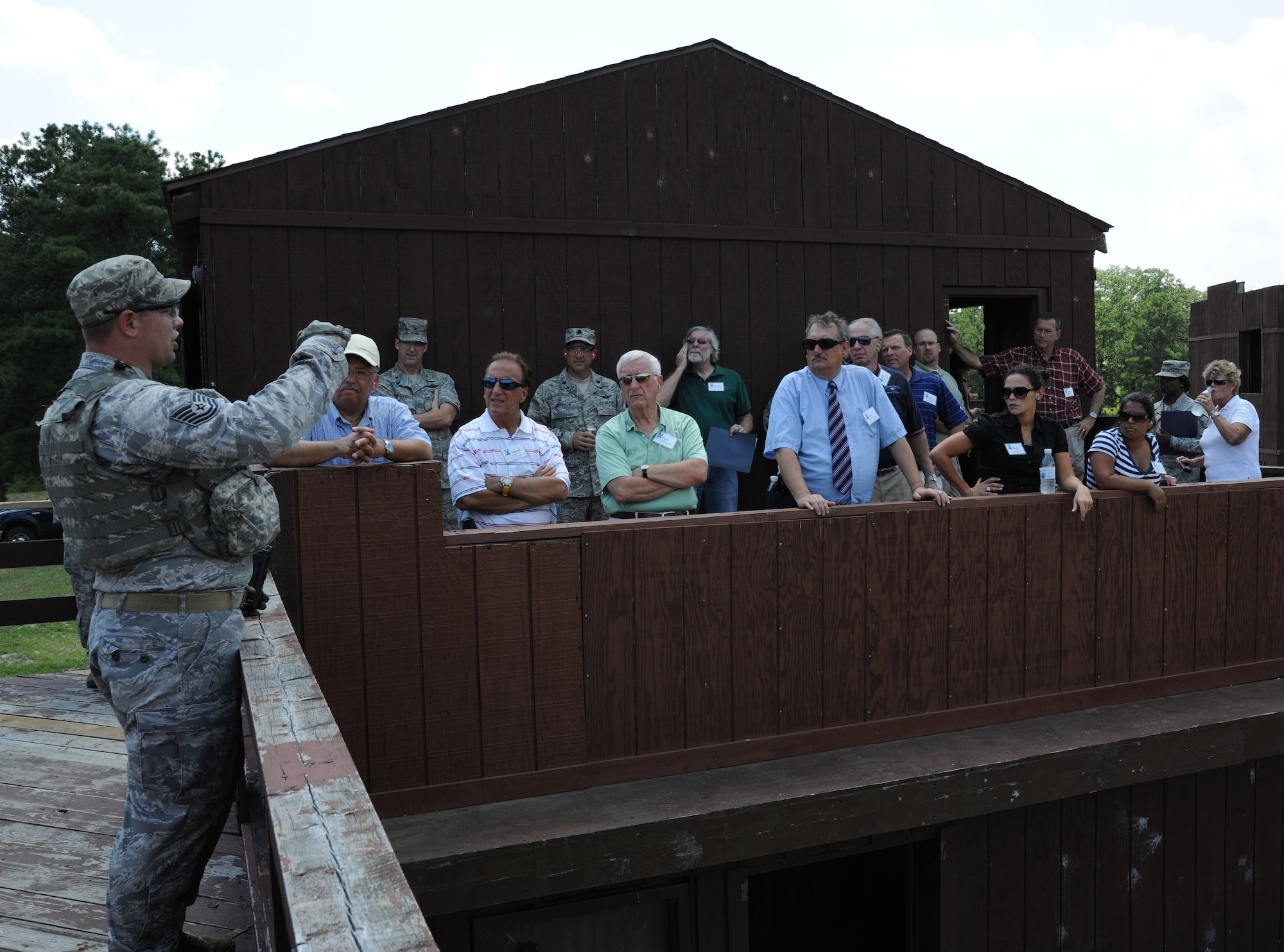 Tech. Sgt. Jason Lowery, 421st Combat Training Squadron, describes the
action to visiting civic leaders during a military operations on urban
terrain training event July 21st at Joint Base McGuire-Dix-Lakehurst, N.J.
The outreach tour informed nearly 20 area community leaders about the
important role the Expeditionary Center plays in training Airmen for
expeditionary operations. The visit also enhanced the EC's ability to build
partnerships within the community.  (U.S. Air Force photo/Staff Sgt. Veuril
McDavid)