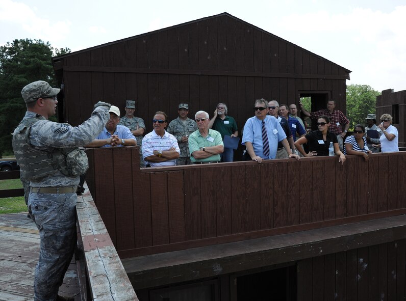Tech. Sgt. Jason Lowery, 421st Combat Training Squadron, describes the
action to visiting civic leaders during a military operations on urban
terrain training event July 21st at Joint Base McGuire-Dix-Lakehurst, N.J.
The outreach tour informed nearly 20 area community leaders about the
important role the Expeditionary Center plays in training Airmen for
expeditionary operations. The visit also enhanced the EC's ability to build
partnerships within the community.  (U.S. Air Force photo/Staff Sgt. Veuril
McDavid)