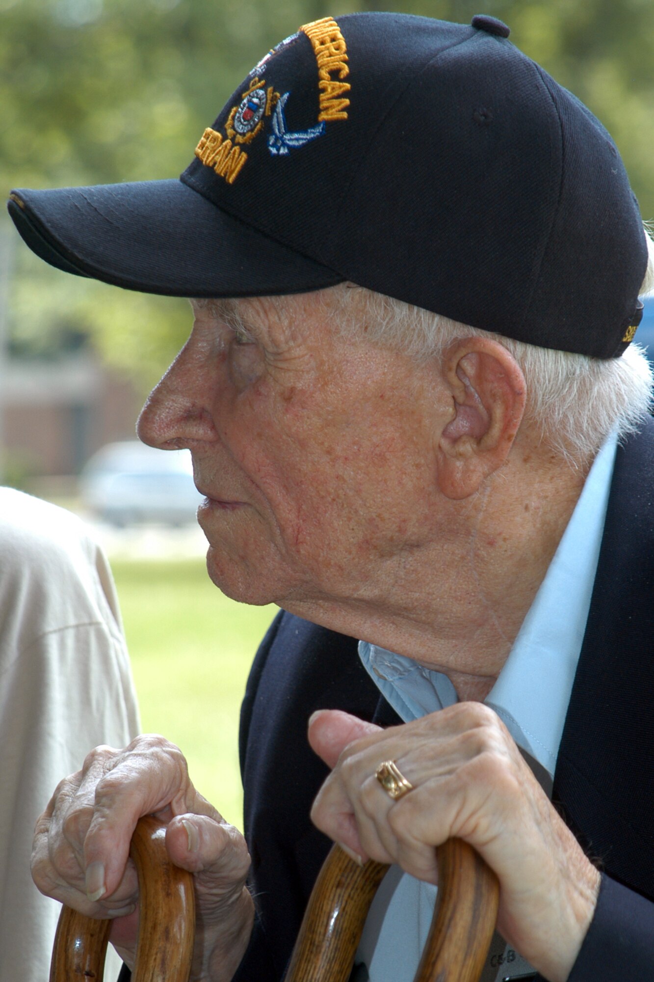 GRISSOM AIR RESERVE BASE, Ind., -- Ike Tharp, a World War II veteran from Kokomo, listens as another veteran shares their experience in the War. The WWII veterans shared their experiences with Grissom Airmen and other members during a "Voices of History" luncheon held in the Grissom Aeroplex July 21. (U.S. Air Force photo/Tech. Sgt. Douglas Hays)