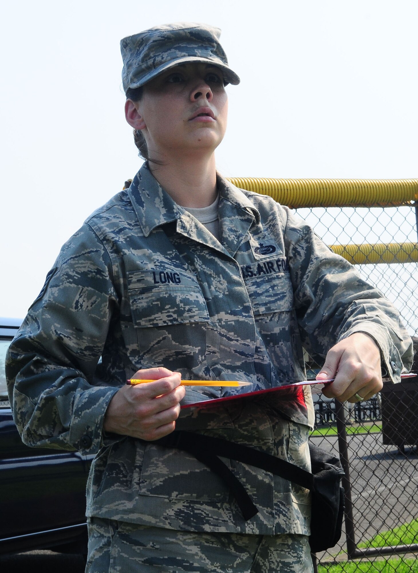 YOKOTA AIR BASE, Japan -- Tech. Sgt. Sonya Long, 374th Force Support Squadron careeer development non-commissioned officer in charge, draws a layout of where things were found July 22 during the Seach and Recovery Core Team Training. The layout is combined with item coordinates to display a diagram of the crash site. (U.S. Air Force photo/Airman 1st Class Sean Martin)
