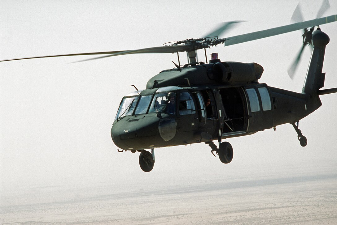 A left front view of a U.S. Army UH-60 Black Hawk helicopter in flight during Operation Desert Shield.