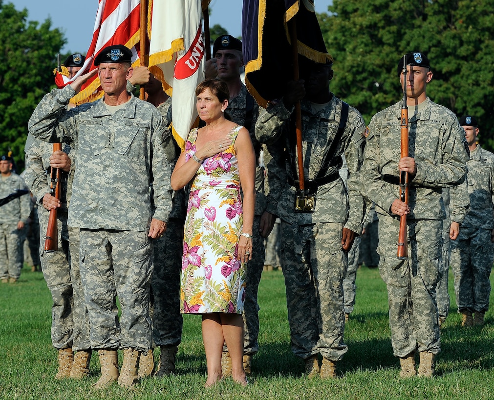 U.S. Army Gen. Stanley McChrystal and wife, Annie, honor the playing of the national anthem during his retirement ceremony on Fort Lesley J. McNair in Washington, D.C., July 23, 2010.  
