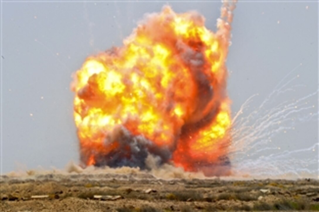 U.S. Army and Iraqi soldiers set off a controlled detonation to destroy unexploded ordnance at a location outside Bassami, Iraq, July 13, 2010.