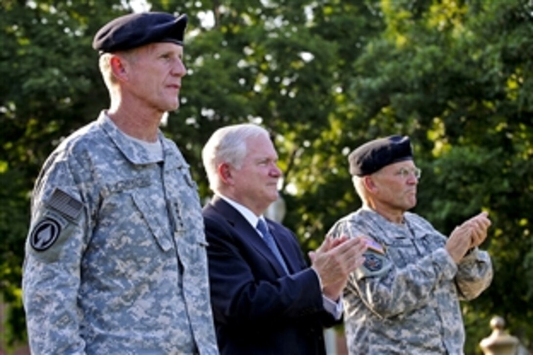 U.S. Army Gen. Stanley A. McChrystal receives a standing ovation from U.S. Defense Secretary Robert M. Gates and U.S. Army Chief of Staff Gen. George W. Casey Jr. during a retirement ceremony for McChrystal on Fort Lesley J. McNair in Washington, D.C., July 23, 2010.