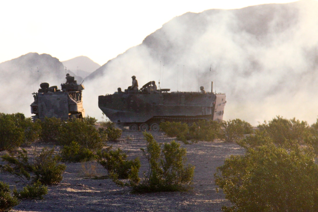 Marines with Kilo Company, 3rd Battalion, 5th Marine Regiment, use amphibious assault vehicles at Marine Corps Air Ground Combat Center Twentynine Palms, Calif., July 23 during exercise Enhanced Mojave Viper. The exercise will prepare Marines for an upcoming deployment to Afghanistan.