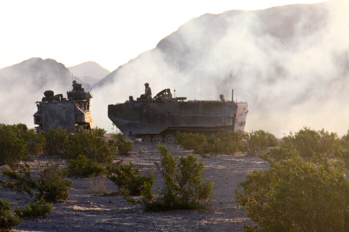 Marines with Kilo Company, 3rd Battalion, 5th Marine Regiment, use amphibious assault vehicles at Marine Corps Air Ground Combat Center Twentynine Palms, Calif., July 23 during exercise Enhanced Mojave Viper. The exercise will prepare Marines for an upcoming deployment to Afghanistan.