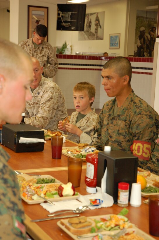 Eleven-year-old Riley Lamberson eats with Marine recruits at the Weapons and Field Training Battalion mess hall July 23. Riley, who has cystic fibrosis, spent a day with Marines at Marine Corps Base Camp Pendleton, Calif., as part of his wish with the Make-a-Wish Foundation. (Official Marine Corps photos by Staff Sgt. Marc Ayalin)