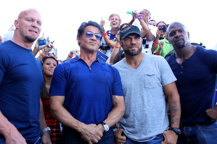 (From left to right) Steve Austin, Sylvester Stallone, Randy Couture and Terry Crews make an appearance at a special screening of the new action film, “The Expendables,” at Camp Pendleton’s base theater, June 24. Stallone and his costars were dropped off at the theater in humvees to a crowd of roaring service members and their families. The celebrities posed for photos and signed autographs before entering the theater to introduce their film. The movie is scheduled to be released in theaters Aug. 13.