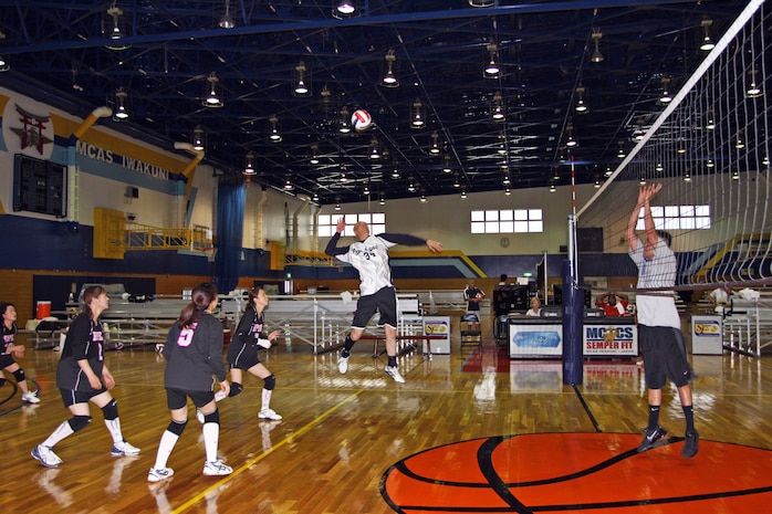Naoki Kanno, player for Hope Atago, prepares to spike the ball to the other side of the court during the annual five-on five volleyball tournament at the IronWorks Gym here July 24. Hope Atago took first place in tournament beating Kings of the Court 10-7 in the final game of the morning. Both Hope Atago and Kings of the Court started out the tournament strong by setting up good plays almost every time and finishing off with swift spikes to the other side of the court.