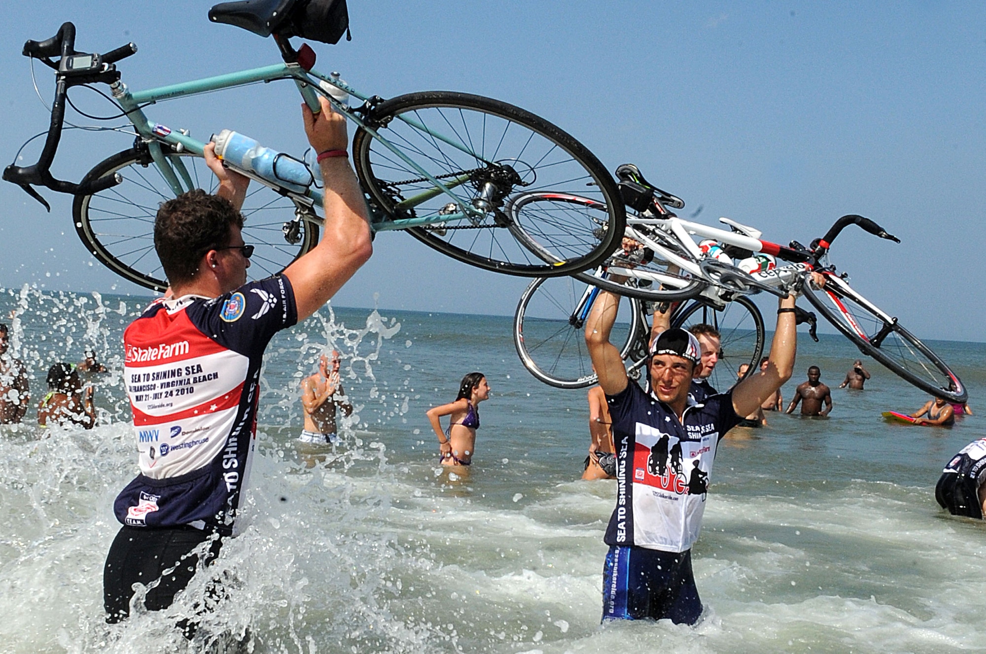 LANGLEY AIR FORCE BASE, Va. -- Riders celebrate in the Atlantic Ocean during the closing ceremony of Sea to Shining Sea at Virginia Beach July 24. Sea to Shining Sea is a 4000 mile bike ride which started at the Golden Gate Bridge and ended in Virginia Beach and includes injured military and a few able-bodied cyclists honoring the courage of our military and the strength of the American spirit.. (U.S. Air Force Photo/Staff Sgt. Christina M. Styer) 